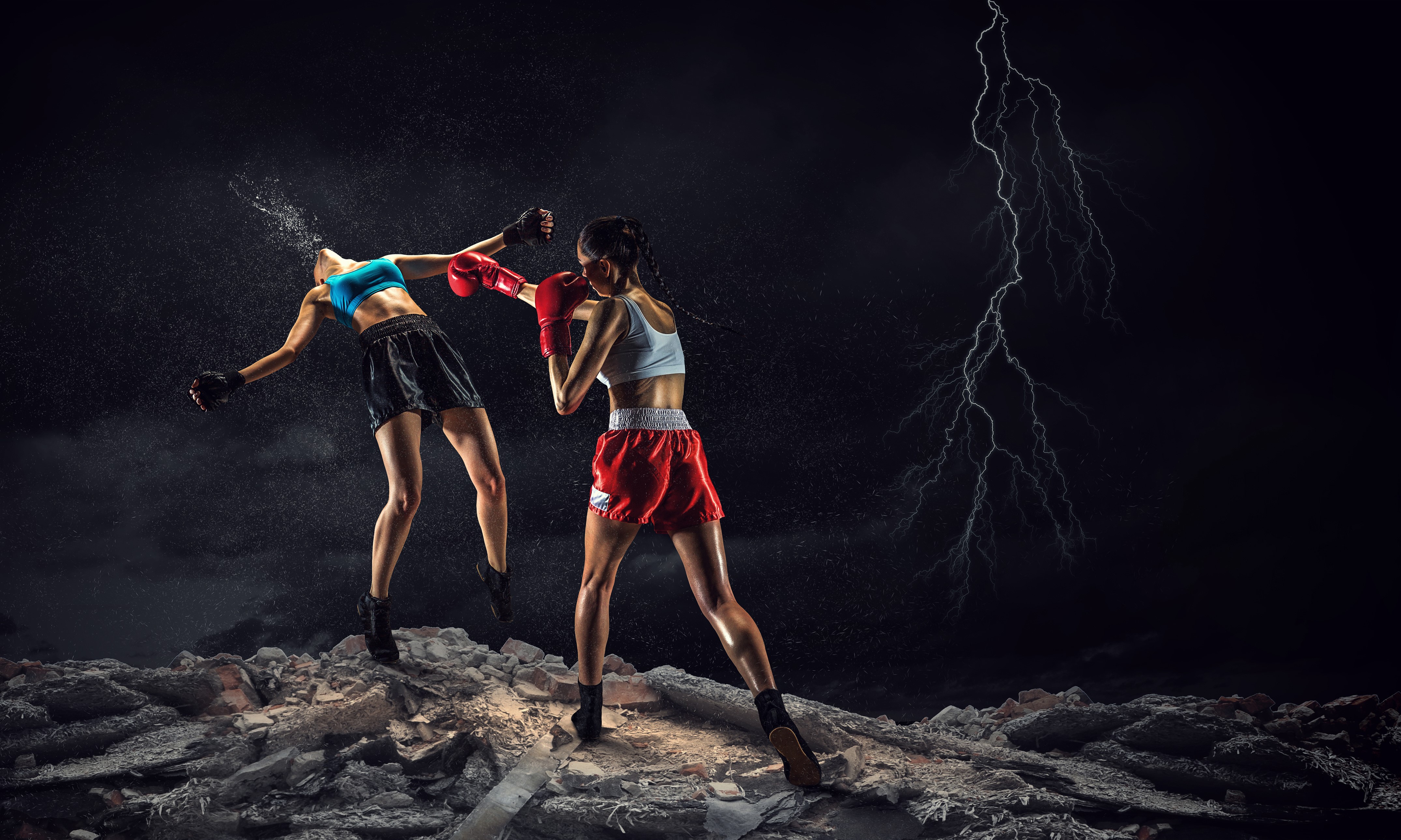 Two female boxers fighting during a lightning storm HD Wallpaper