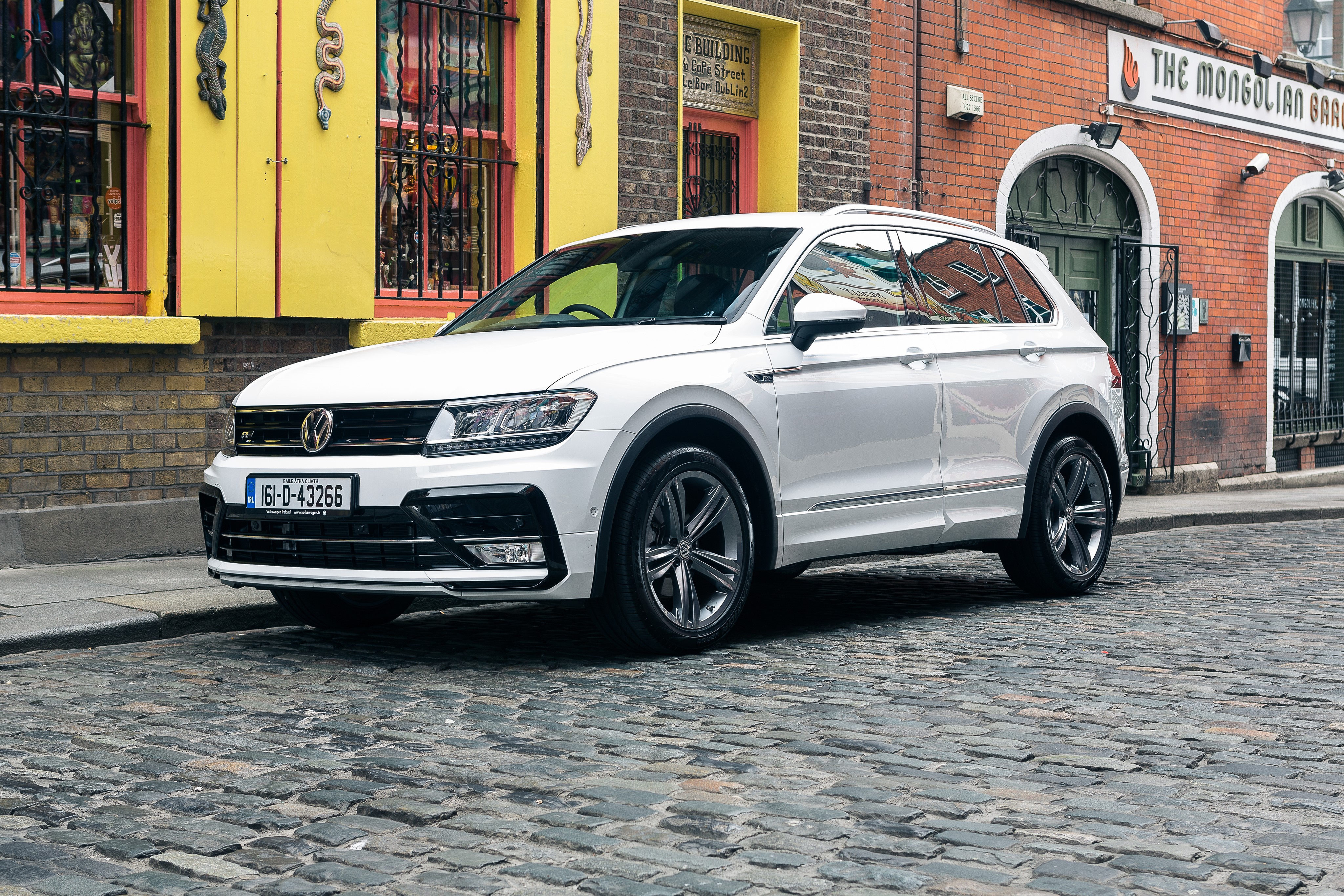White Volkswagen Tiguan R-Line on Cobblestone Street HD Wallpaper