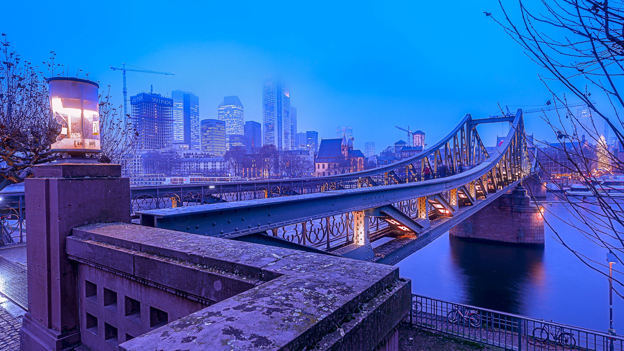 Frankfurt skyline and bridge over river at dusk HD Wallpaper