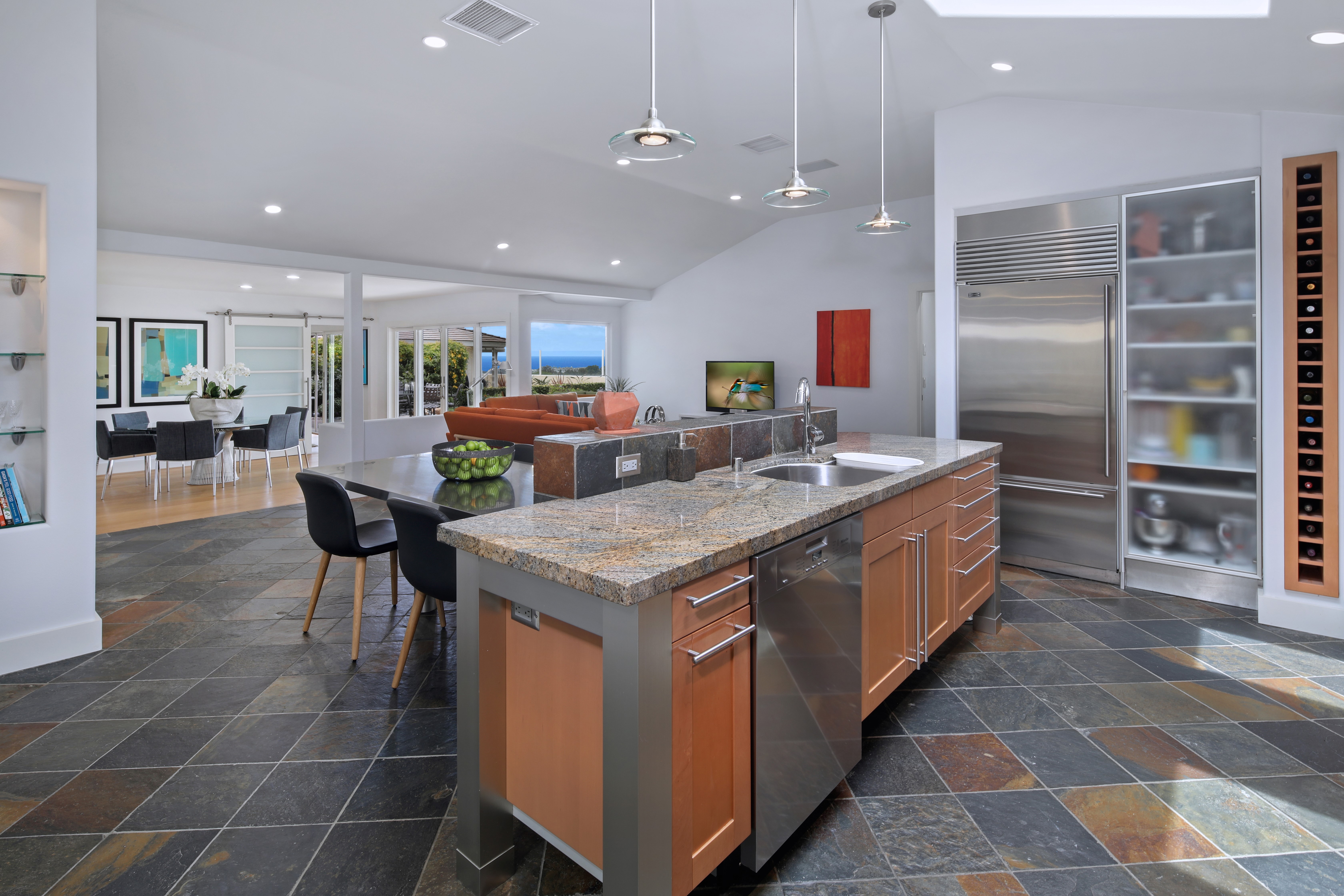 Modern kitchen with island and dining area HD Wallpaper