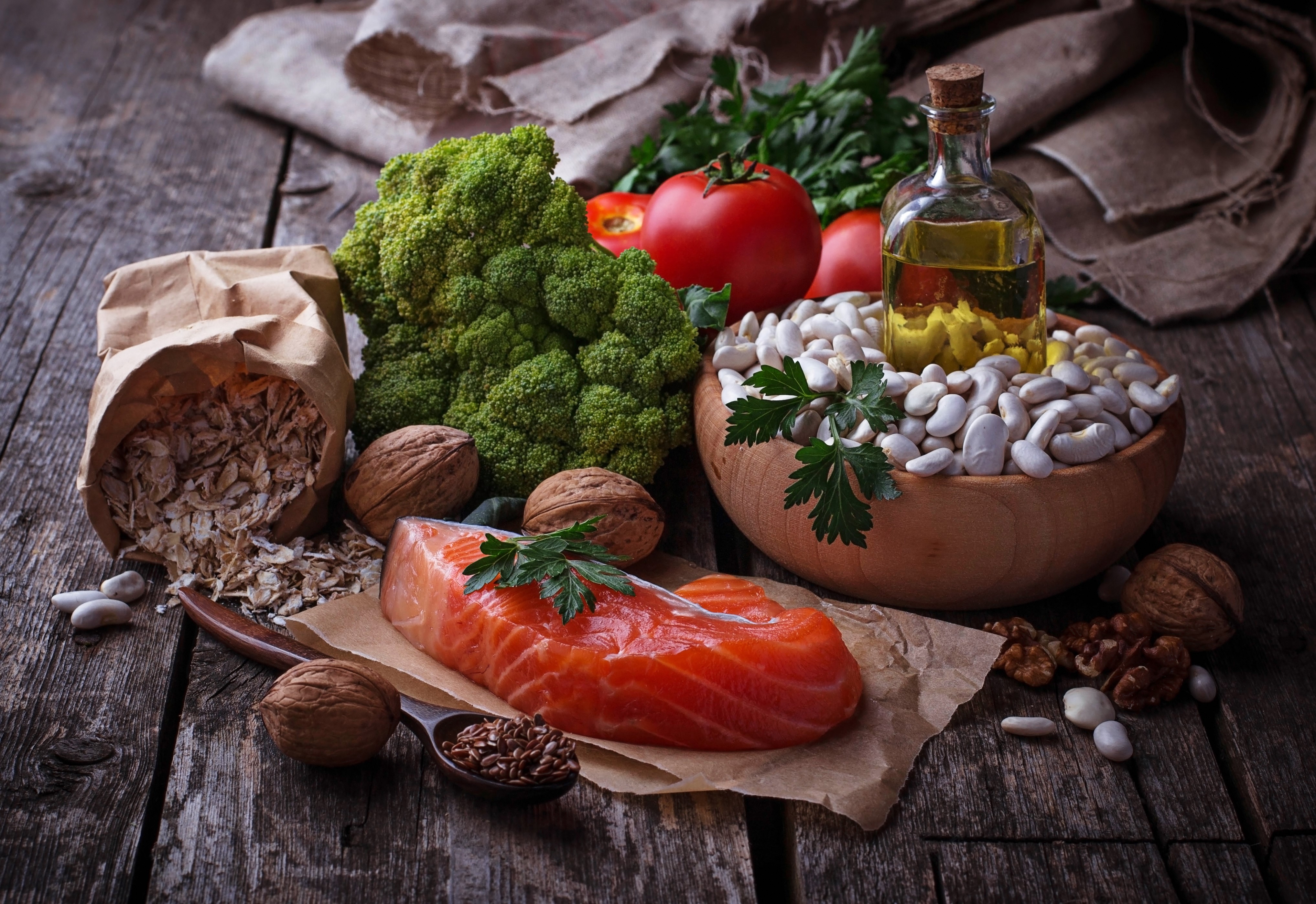 Salmon, Broccoli, Beans, Nuts, and Oil on Wood HD Wallpaper
