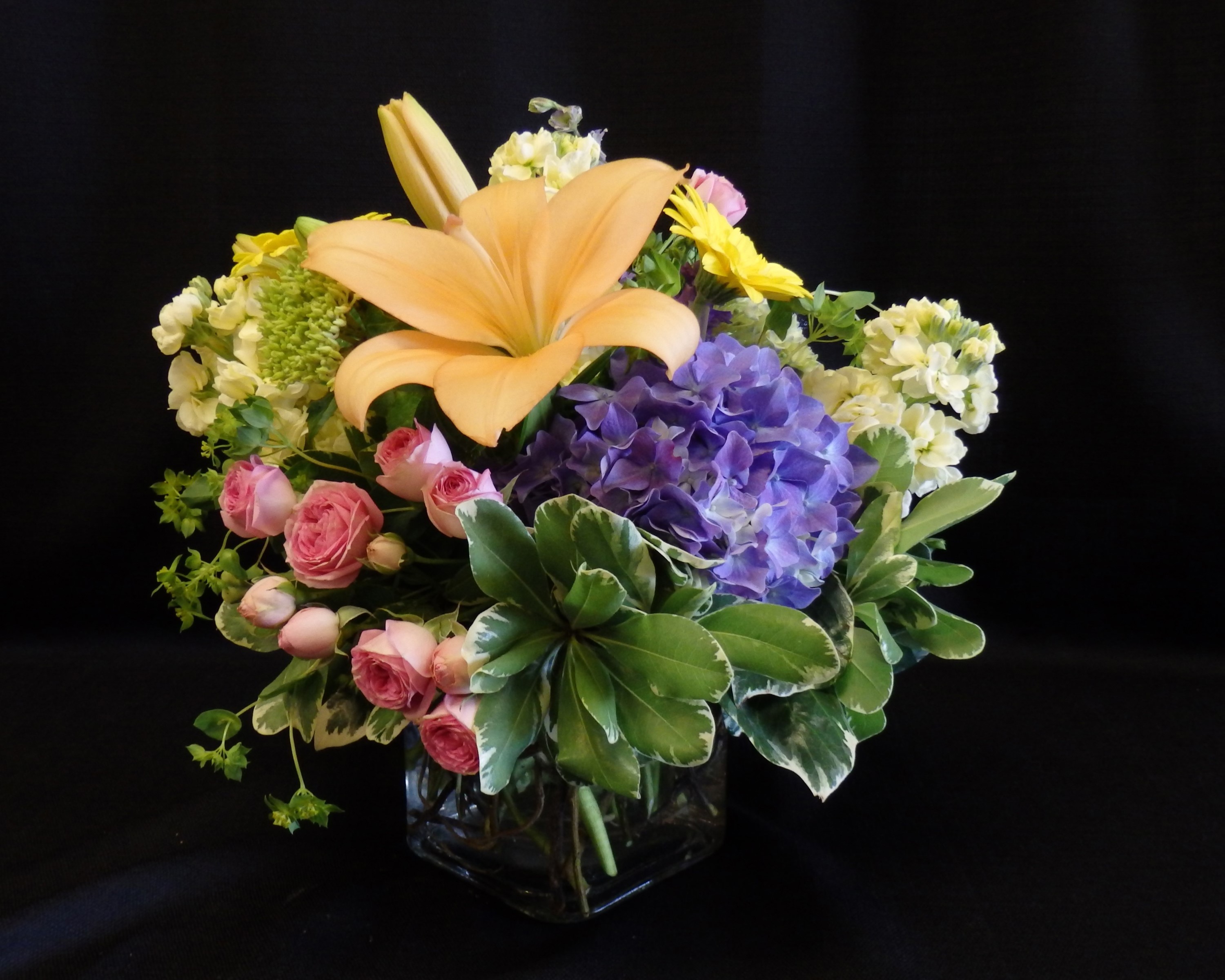 Peach Lily, Roses, Hydrangea, and Yellow Flowers in a Square Vase HD Wallpaper