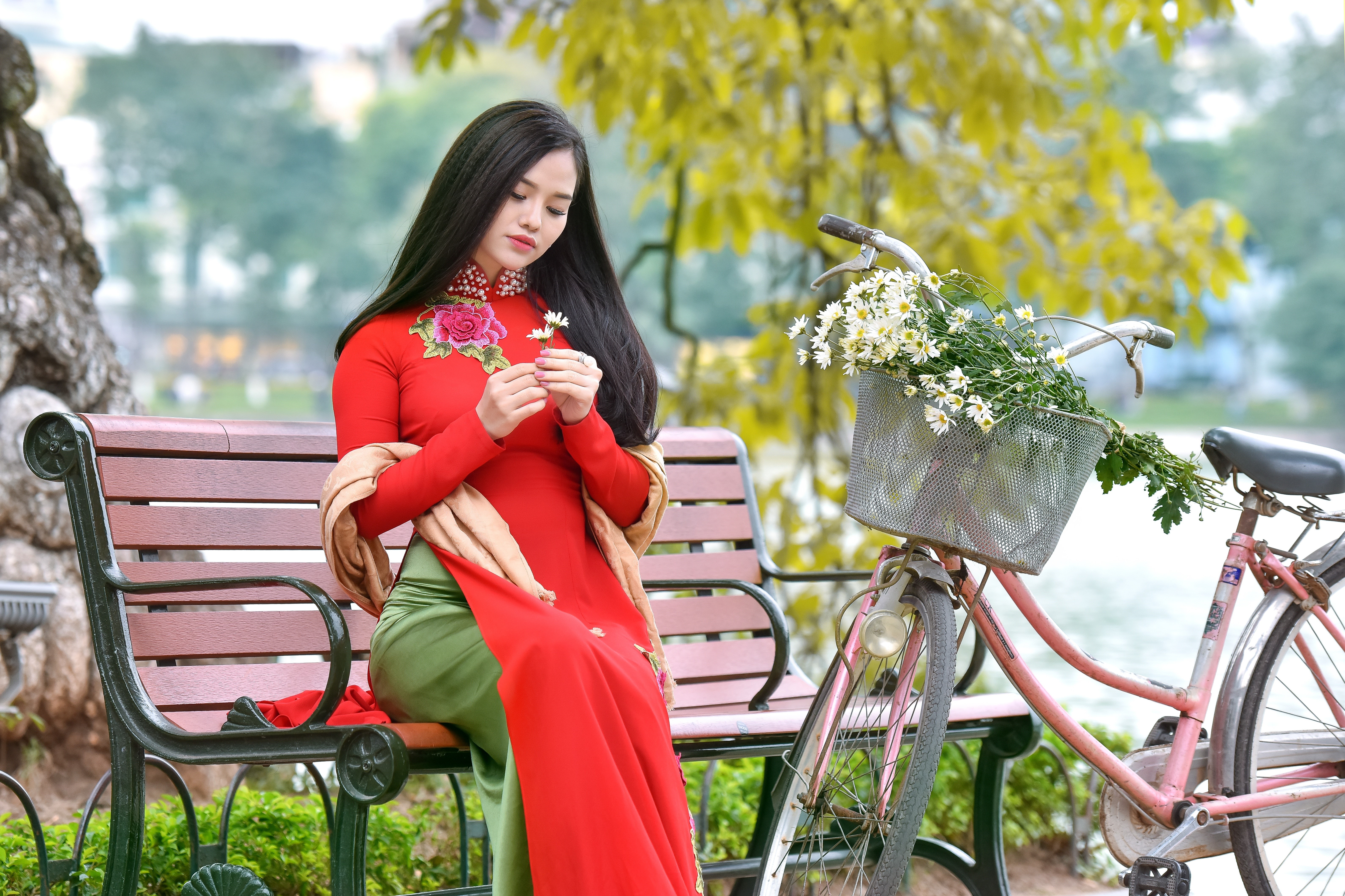 Asian girl in red dress with flowers and bicycle HD Wallpaper
