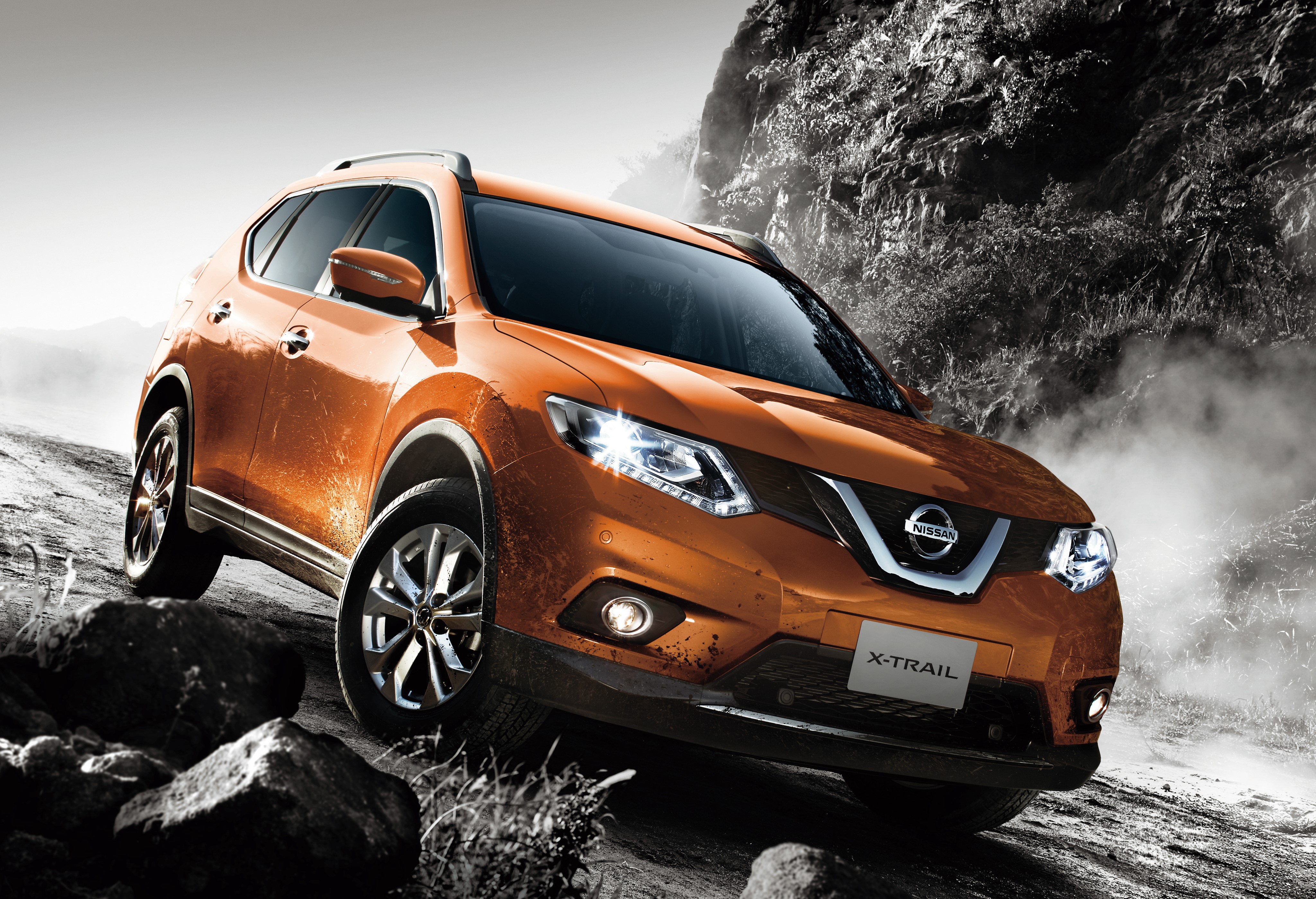 Orange Nissan X-Trail Crossover on Rocky Terrain HD Wallpaper