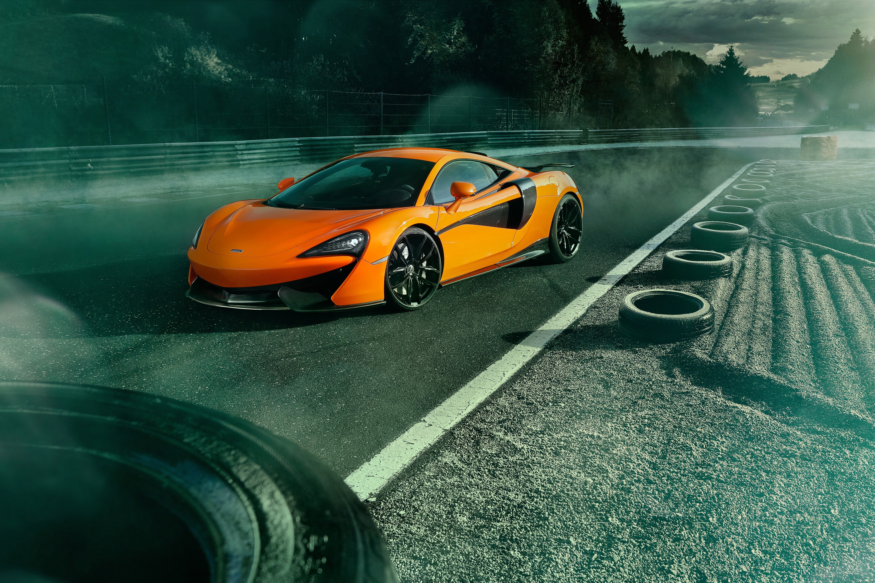 Orange McLaren 570S on a Race Track HD Wallpaper
