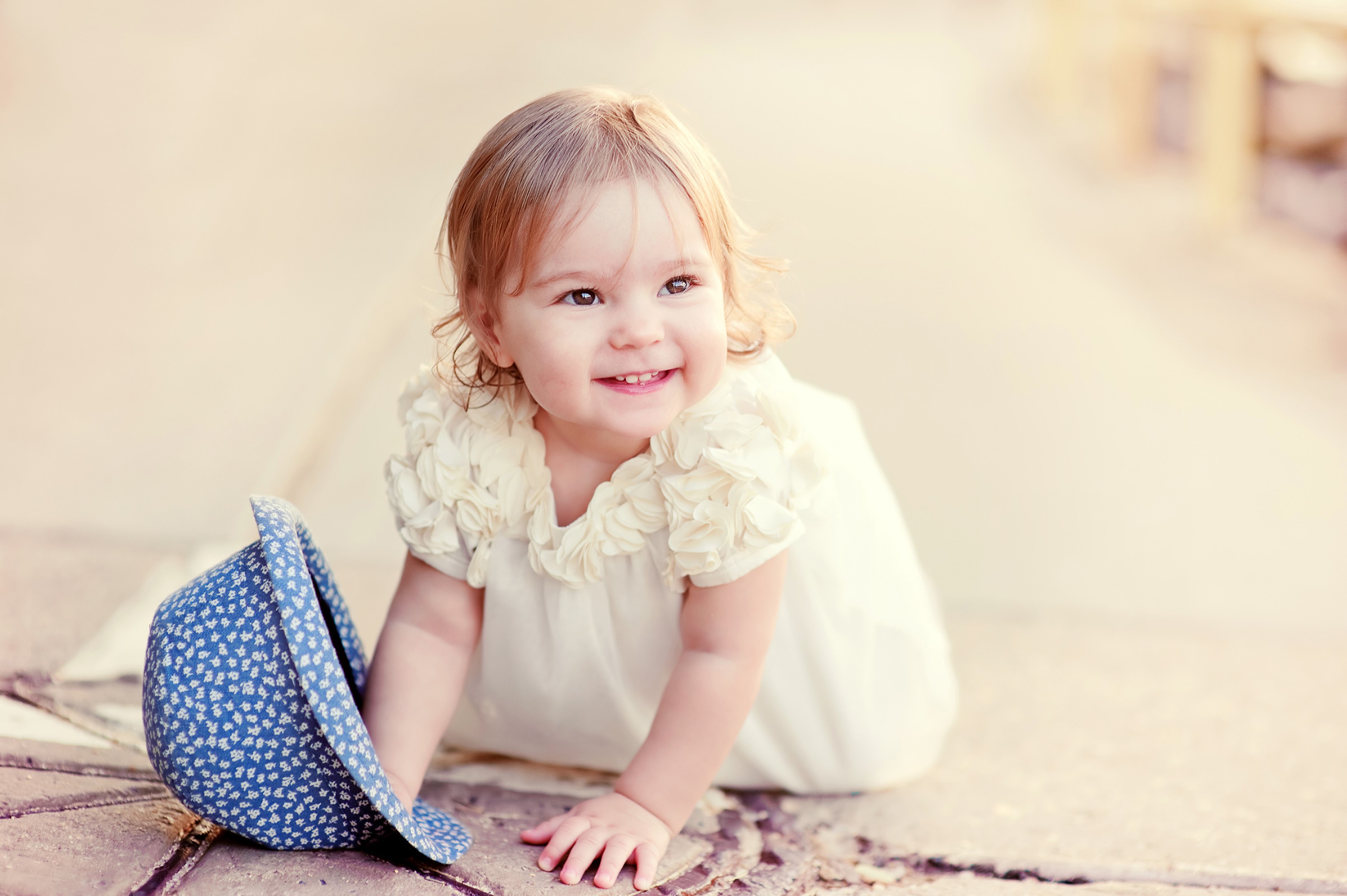 Baby girl in a white dress with a blue hat HD Wallpaper