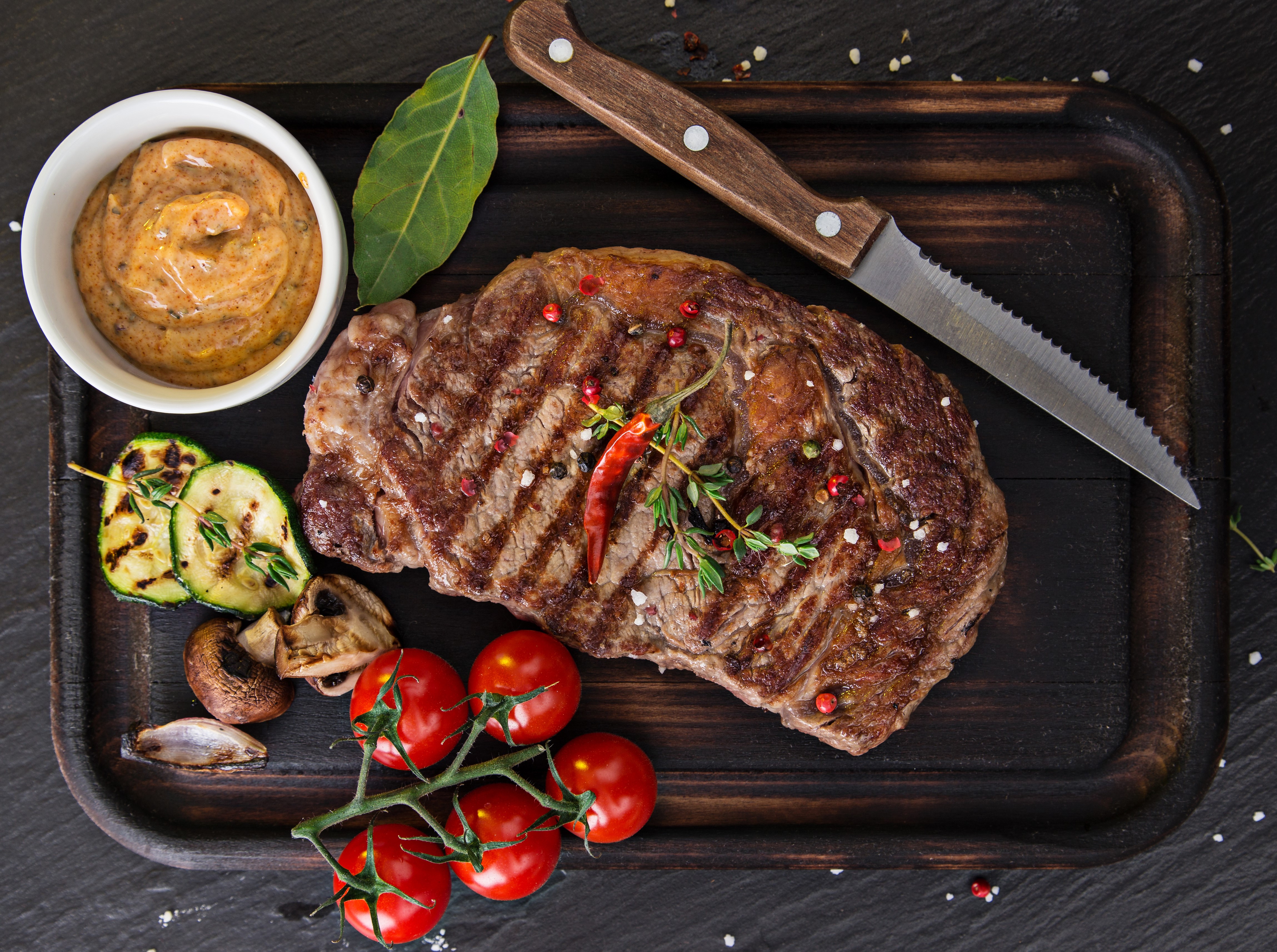 Grilled Steak with Cherry Tomatoes and Zucchini on Cutting Board HD Wallpaper