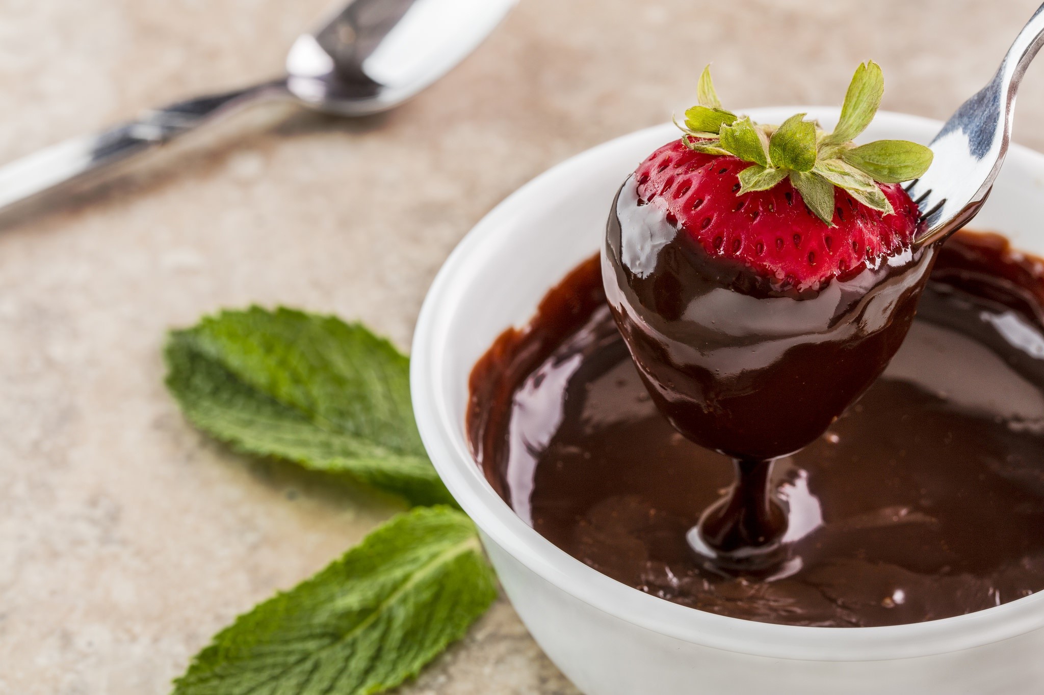 Chocolate-dipped strawberry on a fork HD Wallpaper