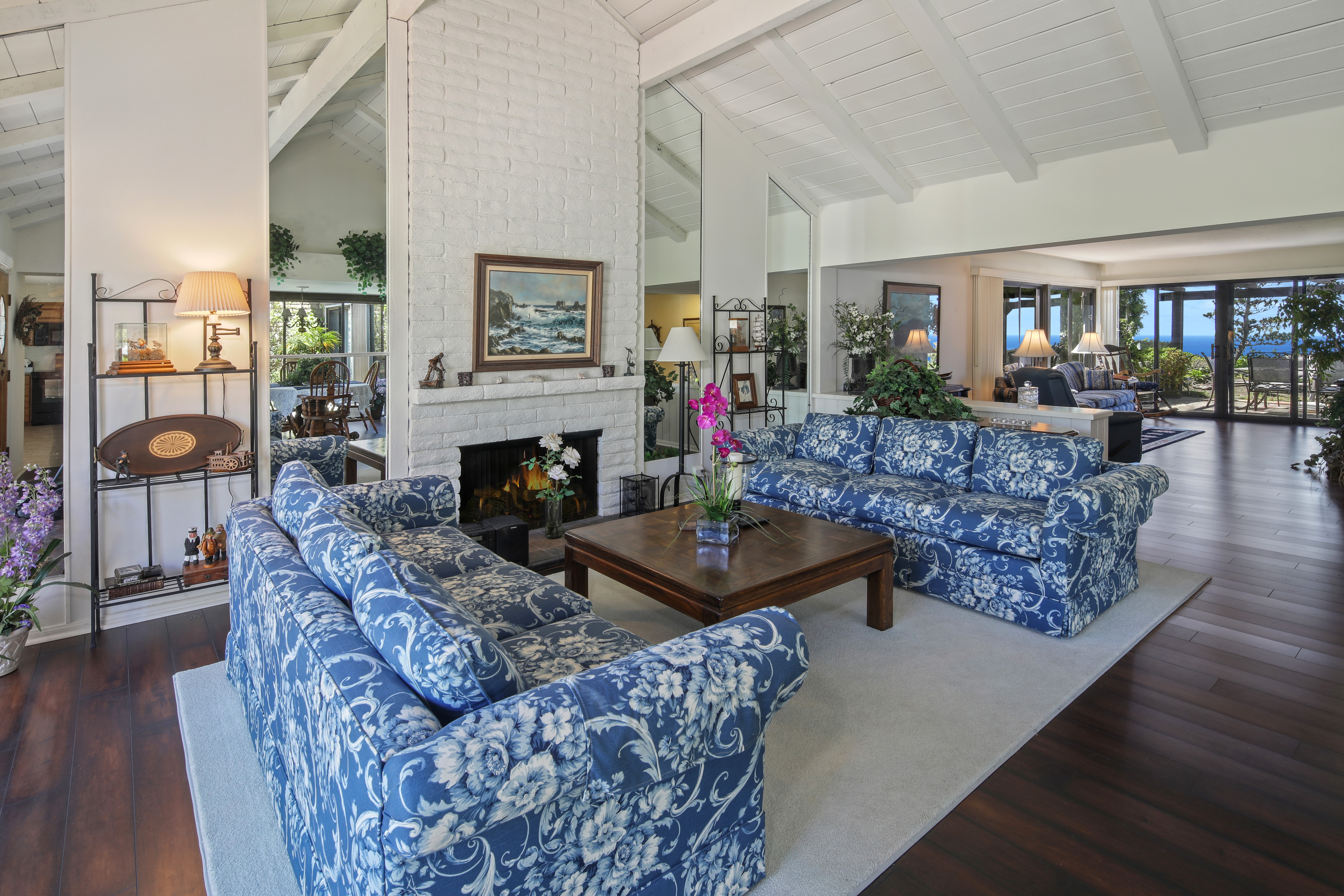 Living room with sofas and fireplace HD Wallpaper