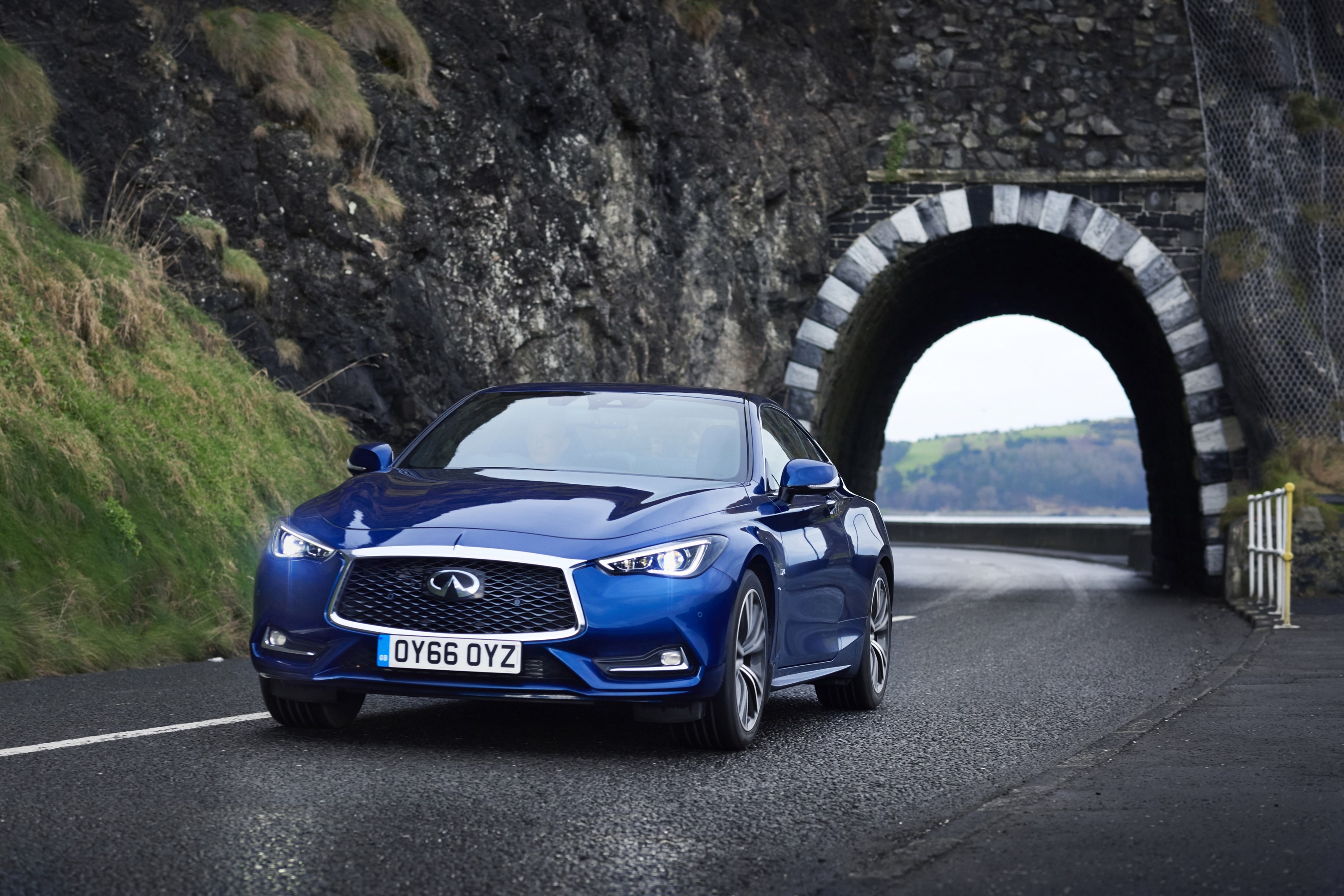 Blue 2016 Infiniti Q60 2.0t driving near a tunnel HD Wallpaper