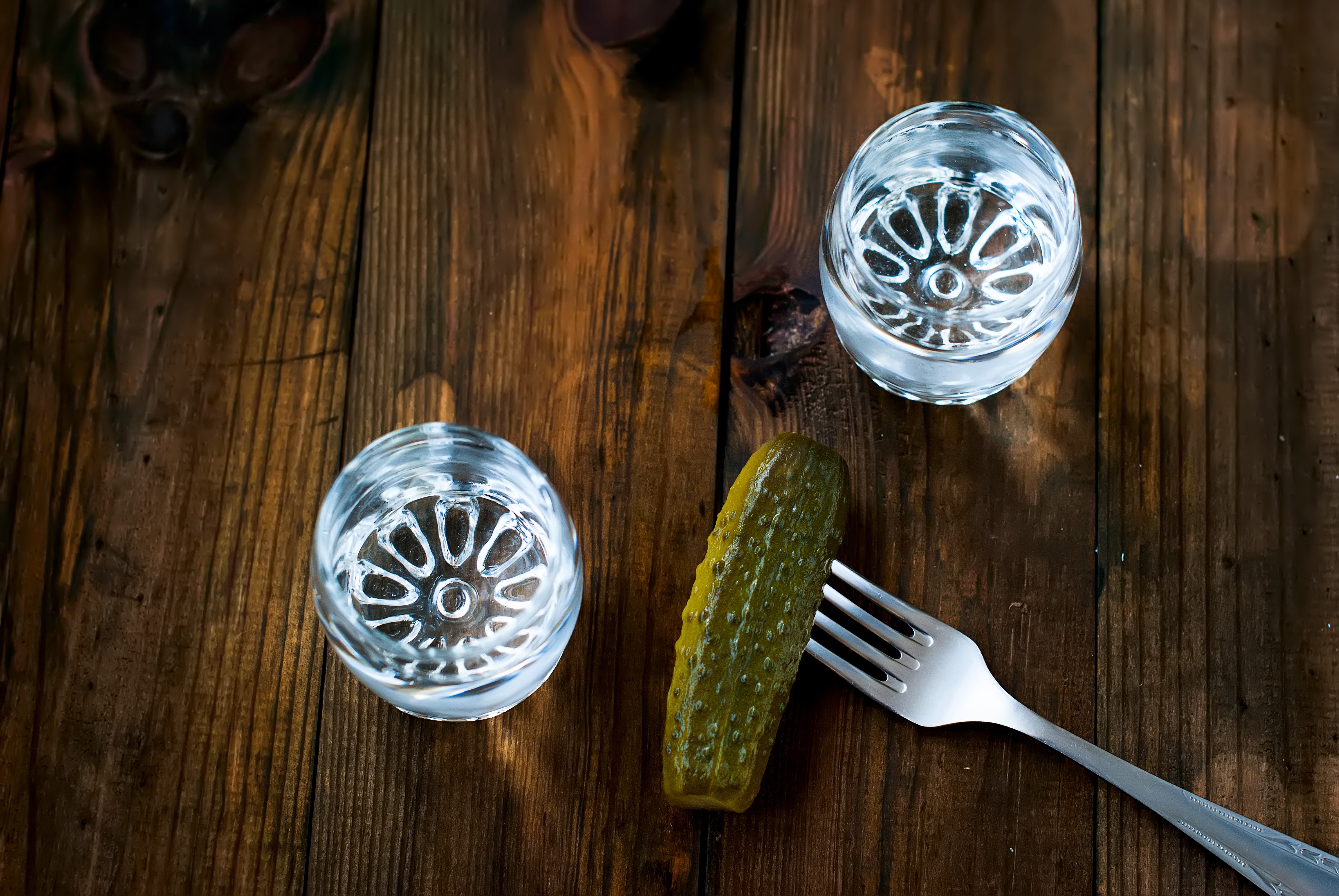 Vodka shots with a pickle on a fork HD Wallpaper