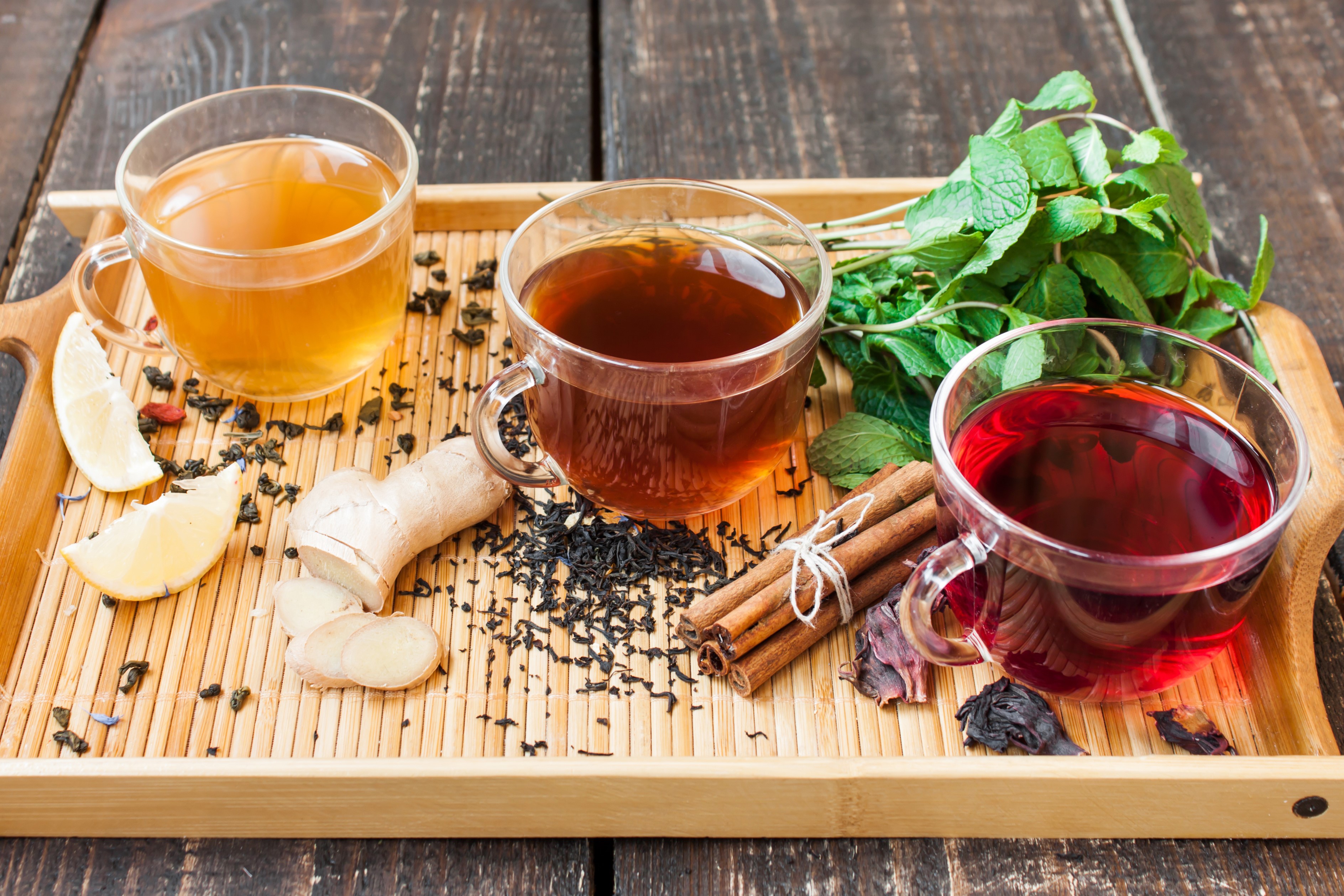 Three cups of tea with ginger, lemon, mint, and cinnamon HD Wallpaper