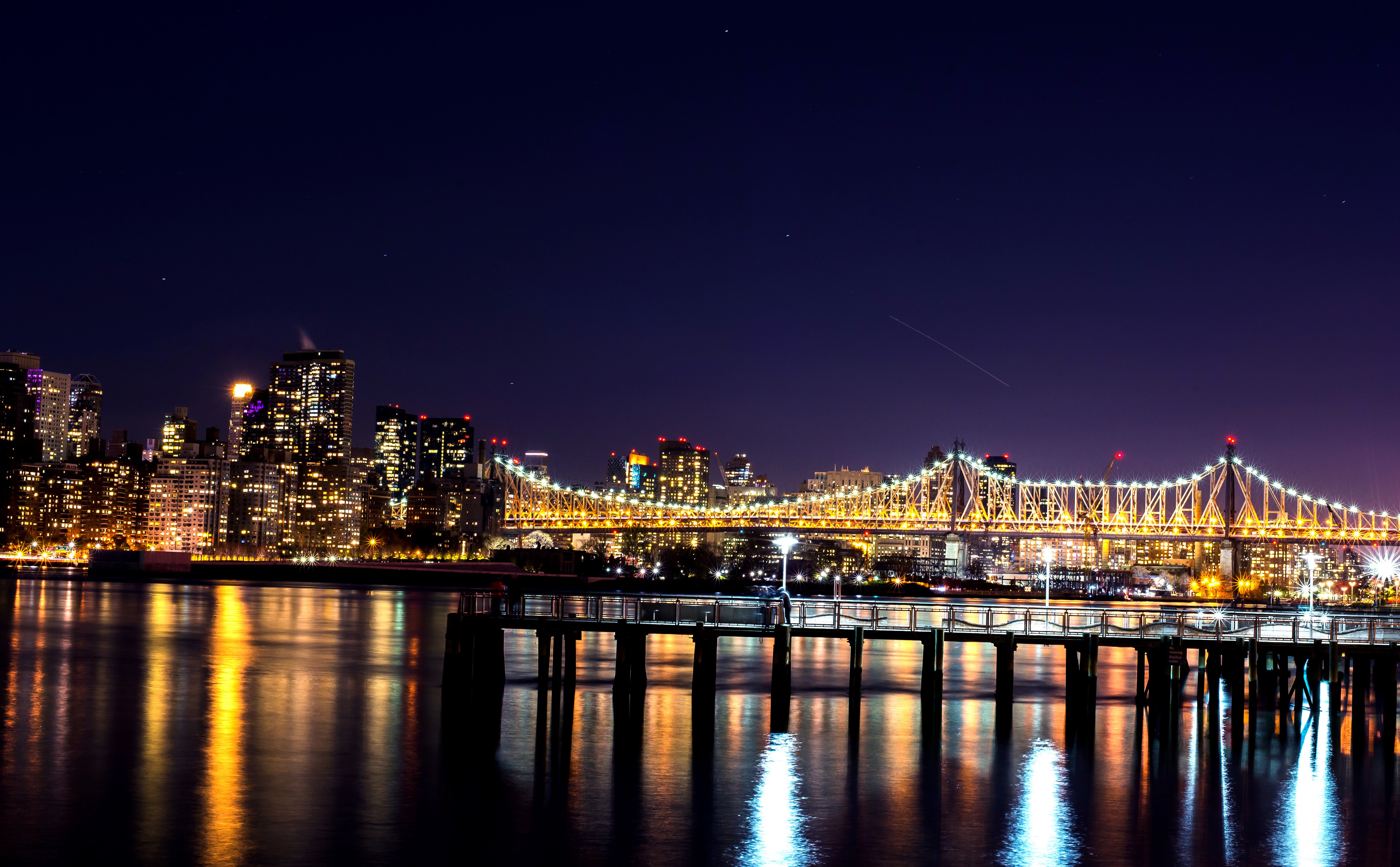 New York City skyline and bridge at night HD Wallpaper