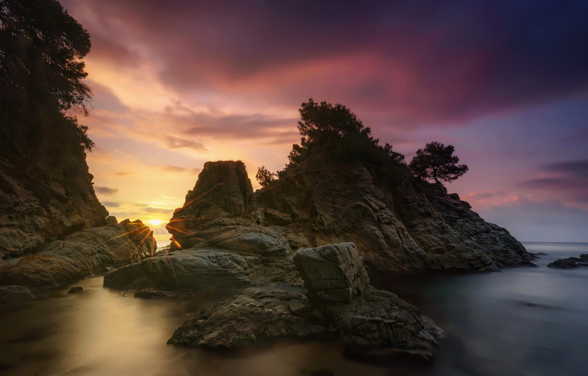 Rocky coast at sunset with colorful sky in Almeria, Spain HD Wallpaper