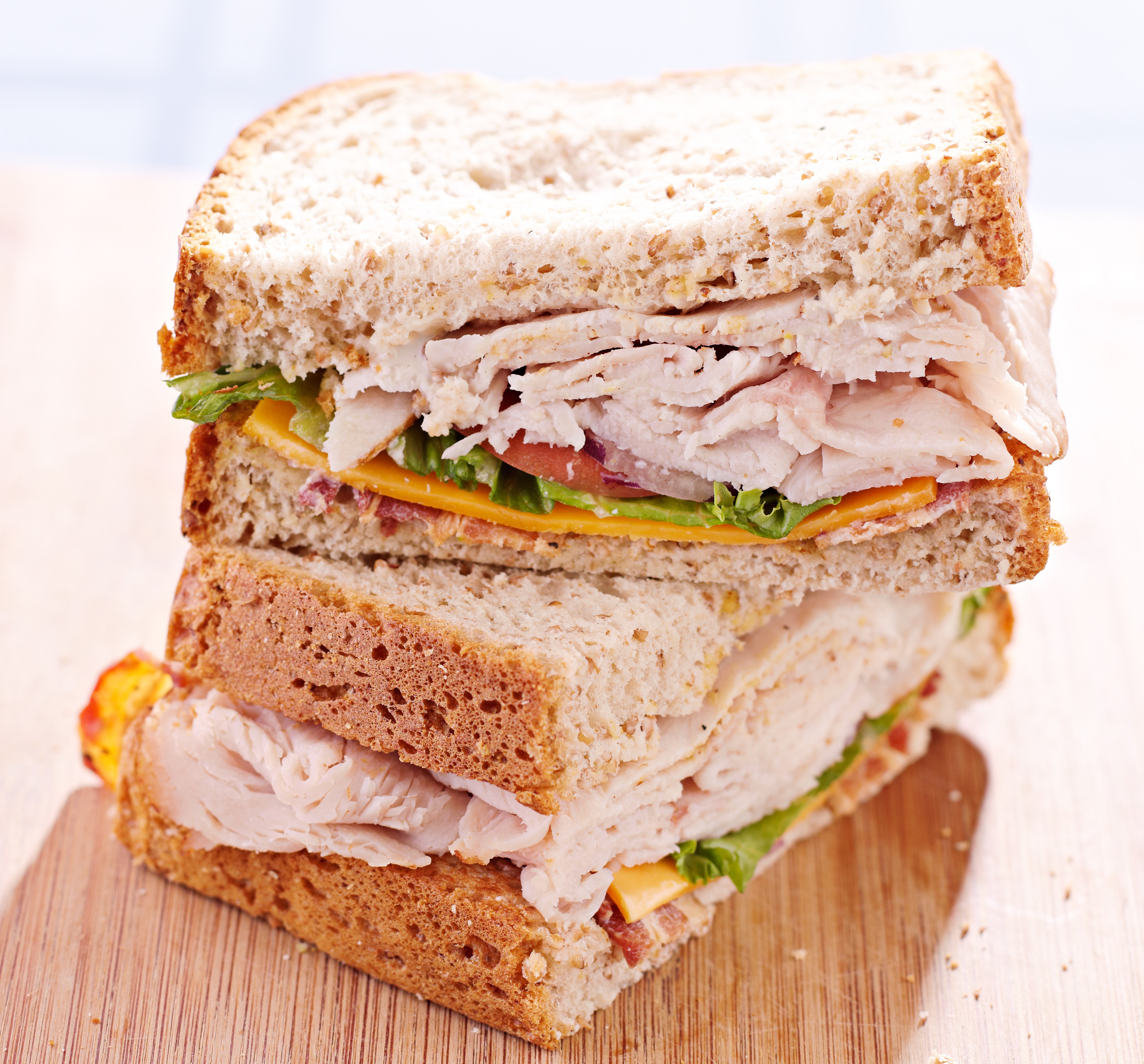 Stack of Turkey Sandwiches on Whole Wheat Bread HD Wallpaper