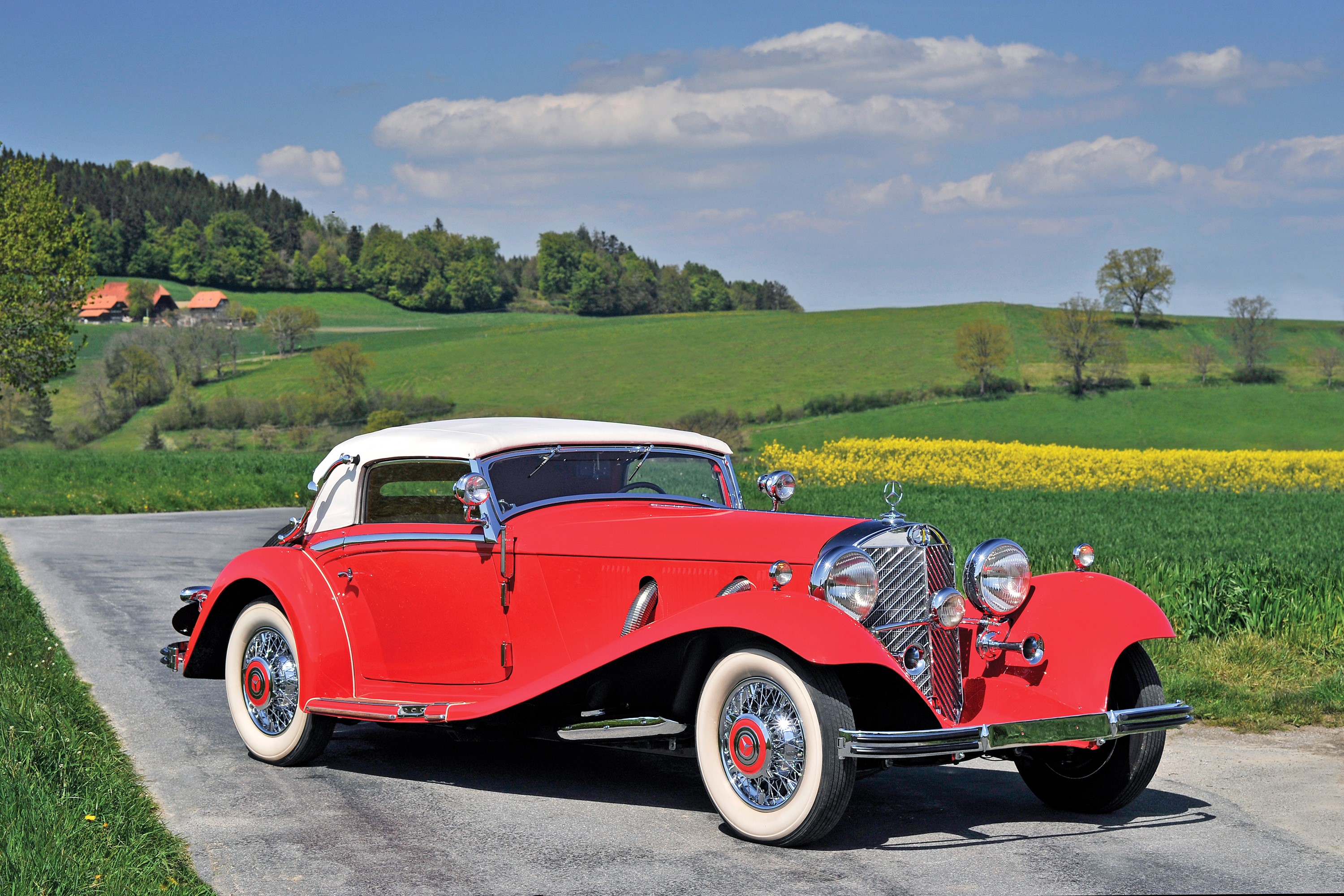 1934 Mercedes-Benz 500K Cabriolet A in a rural landscape HD Wallpaper