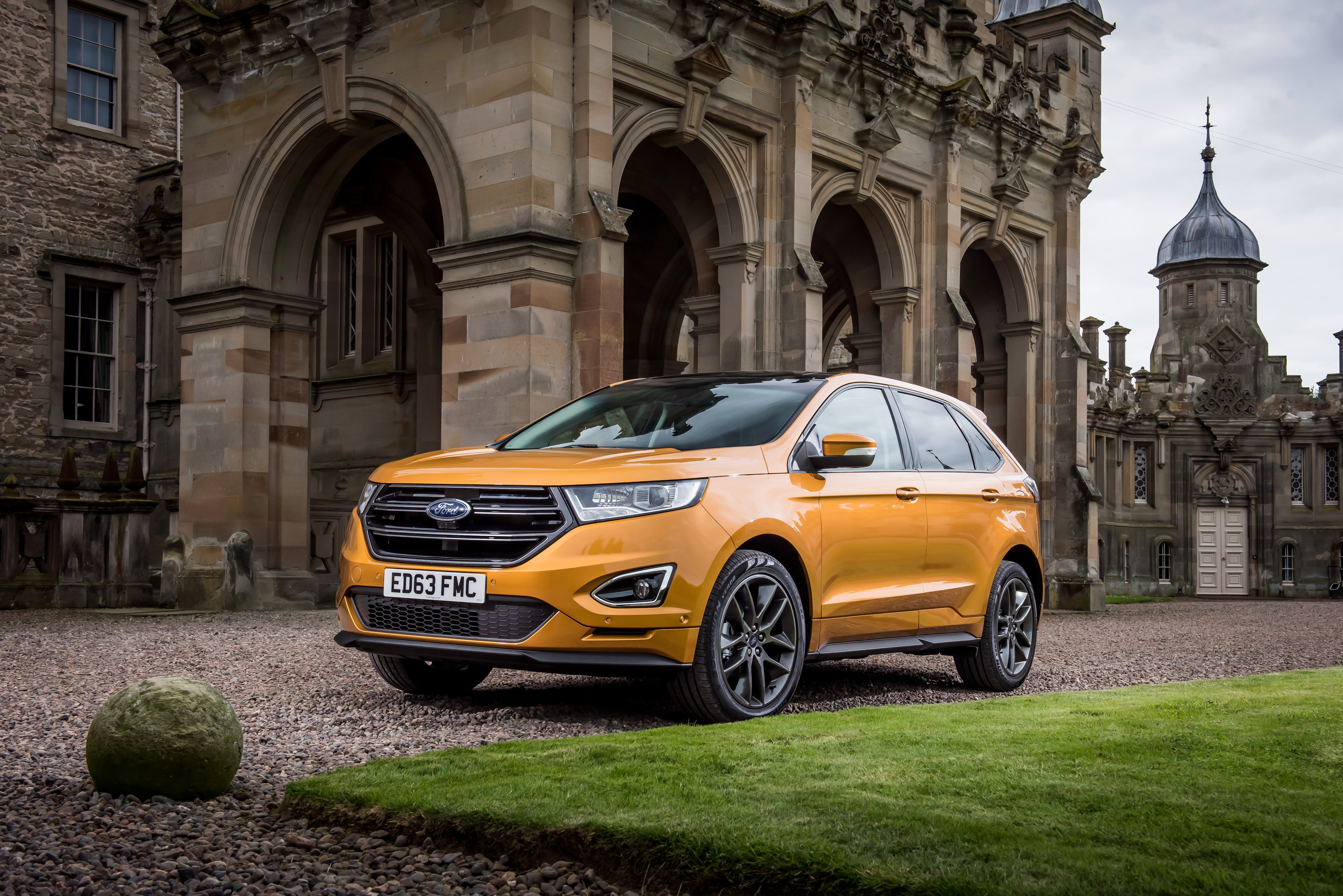 Yellow Ford Edge Sport in front of a castle HD Wallpaper