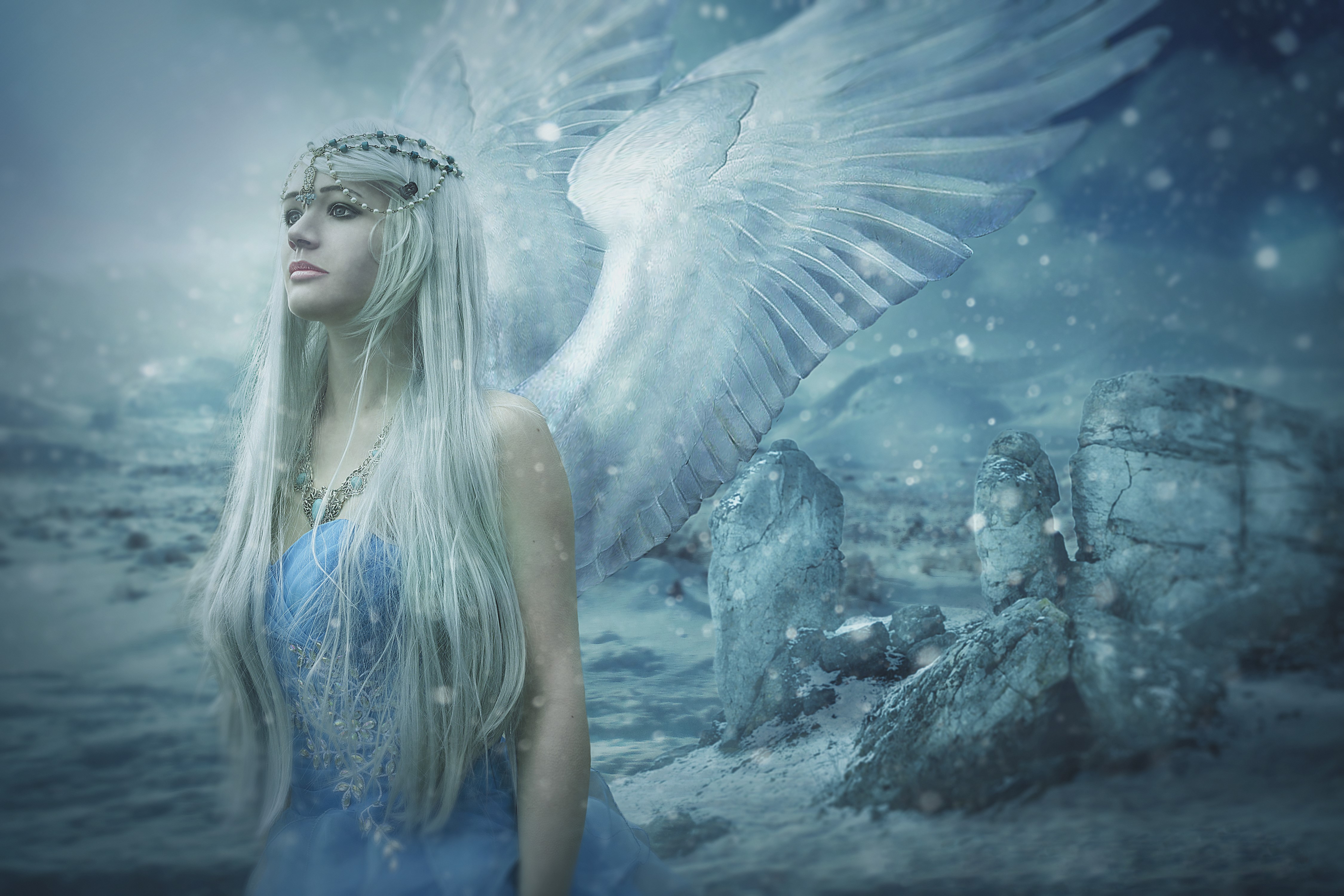 Angel with white wings in a snowy landscape HD Wallpaper