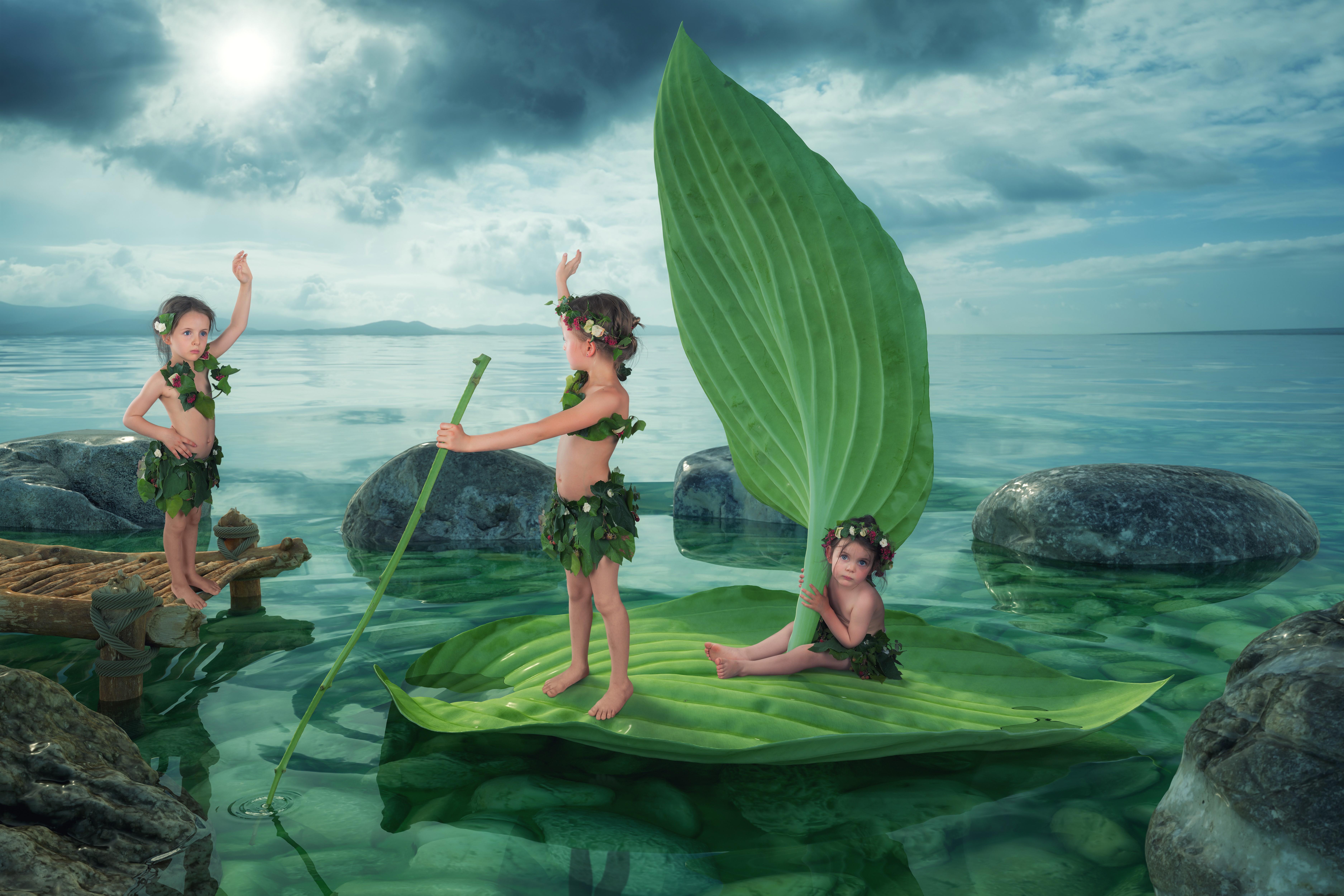 Three little girls in foliage costumes on a leaf boat HD Wallpaper