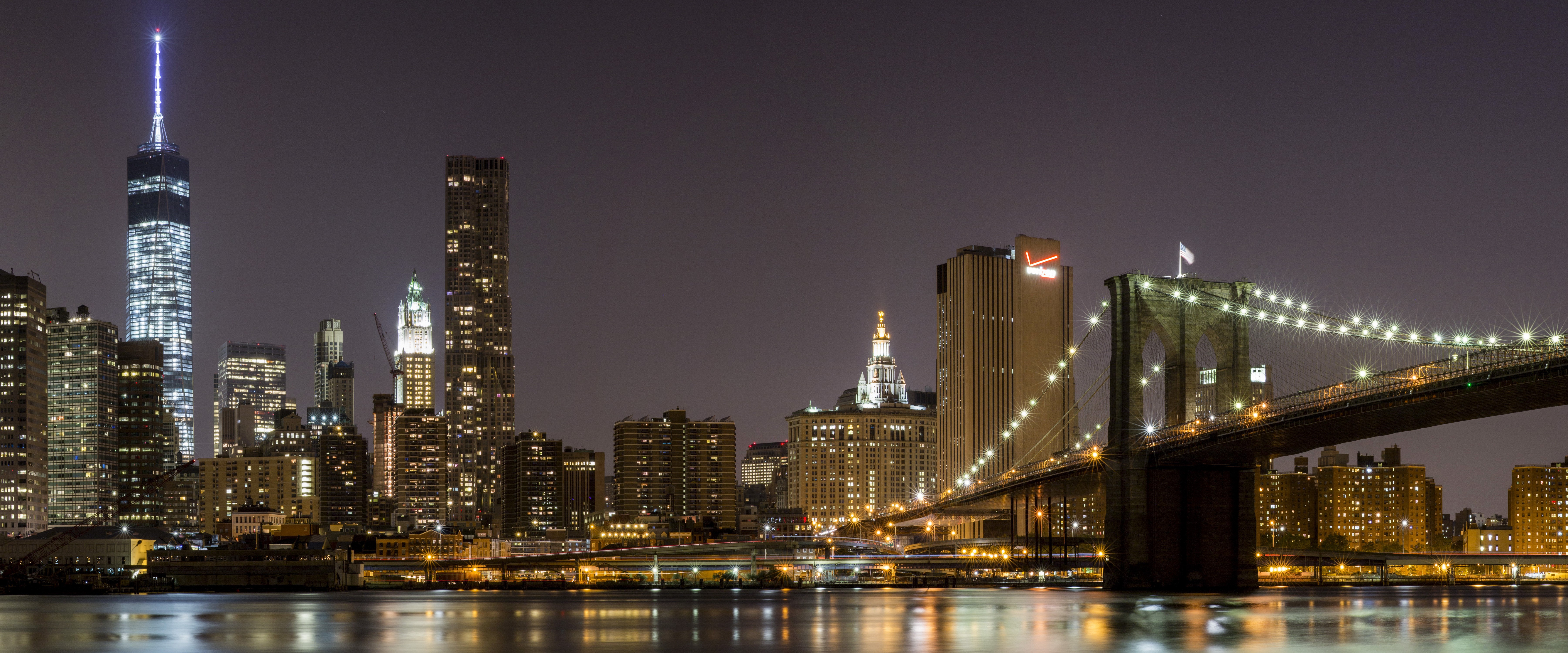 New York City Skyline and Brooklyn Bridge at Night HD Wallpaper