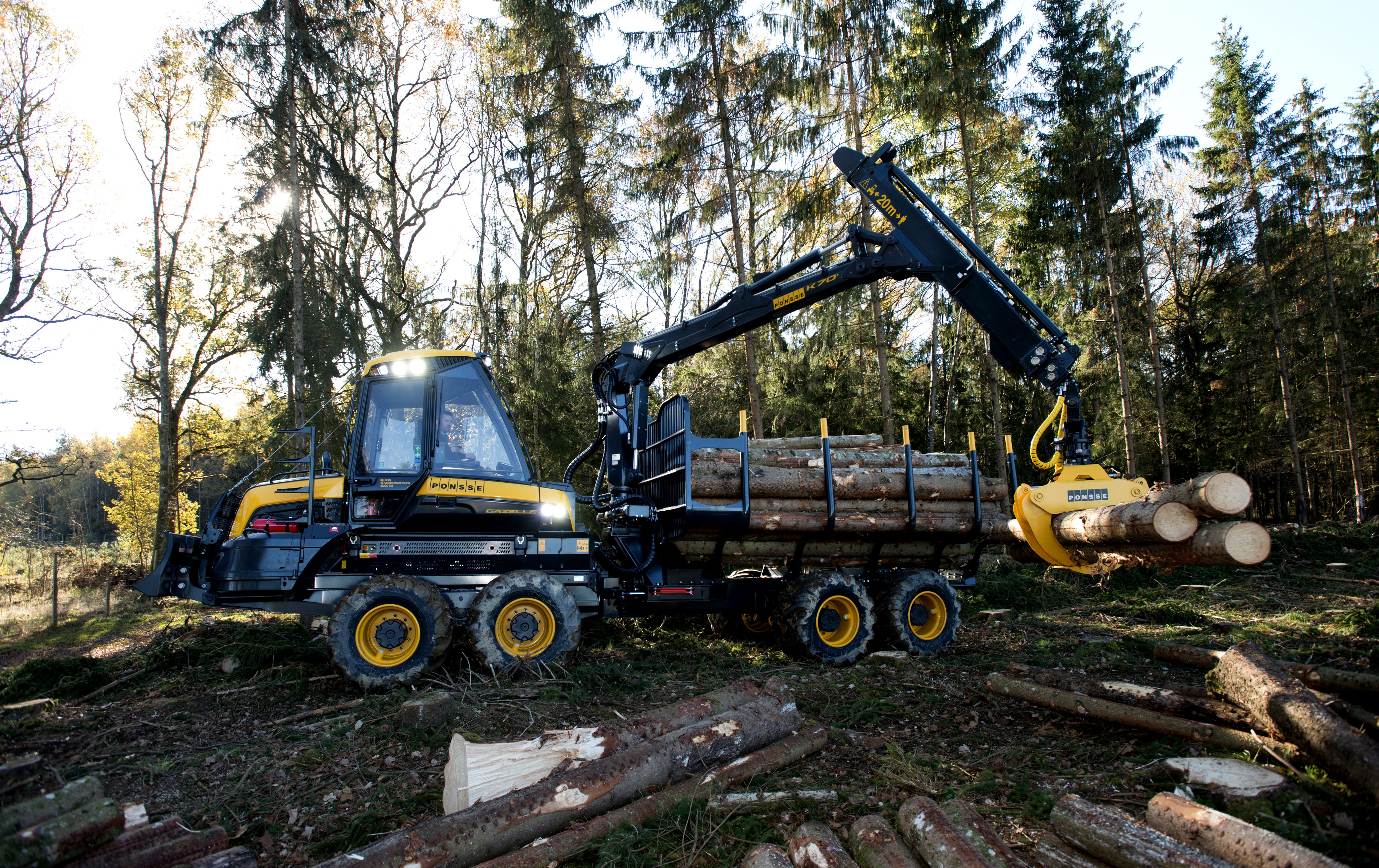 4K Ponsse Gazelle Forwarder loading logs in forest HD Wallpaper