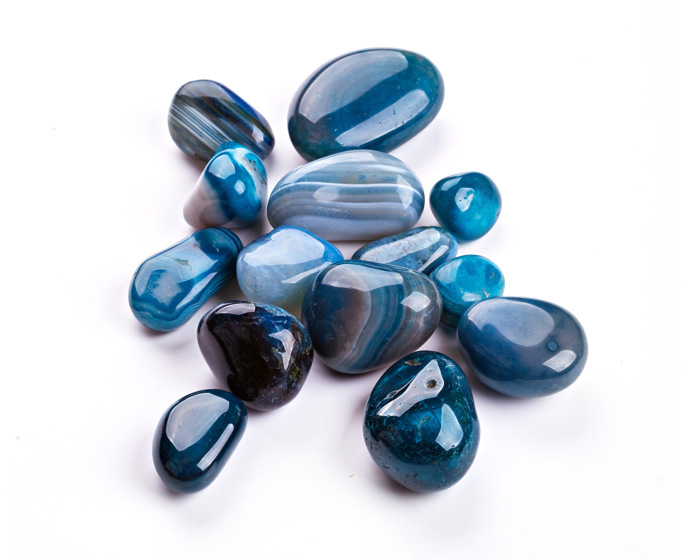 Blue and white striped agate stones on a white background HD Wallpaper