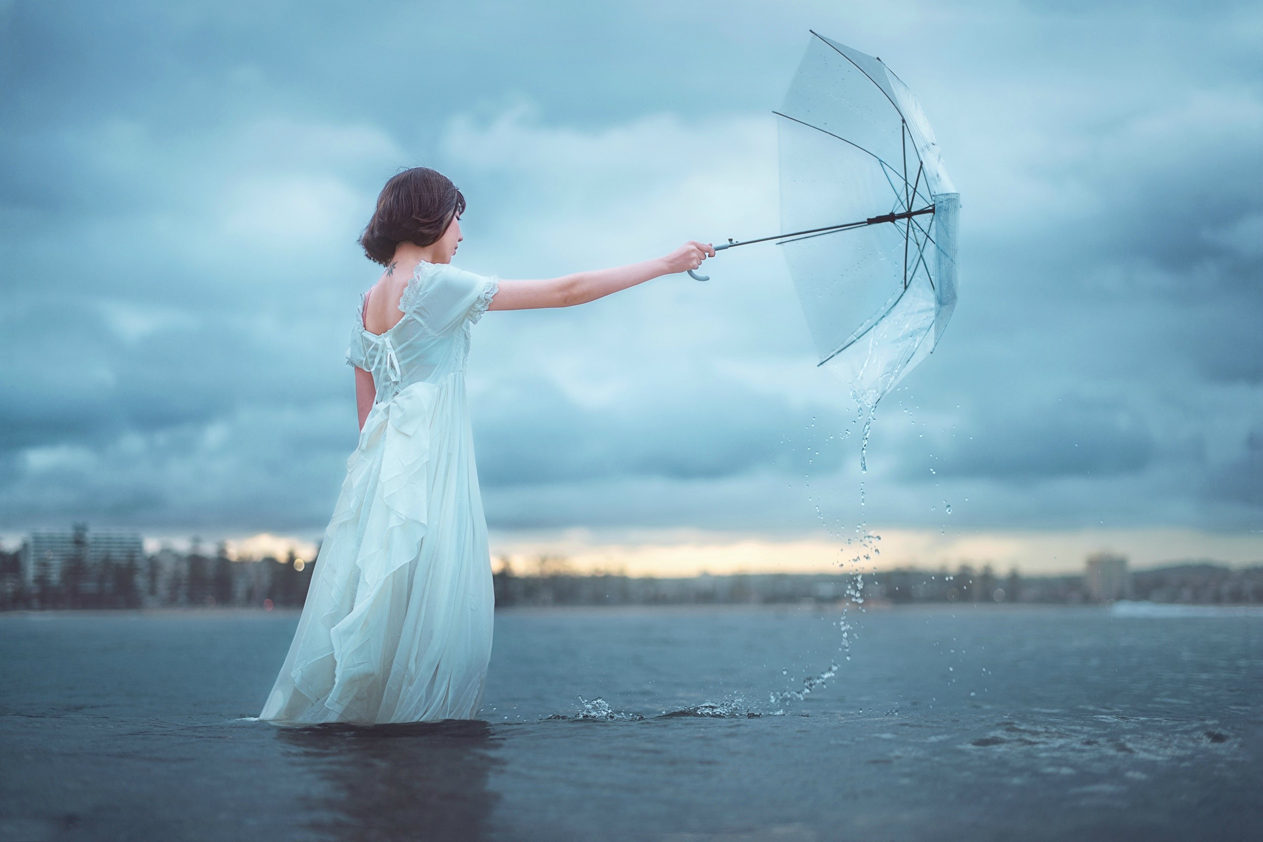 Woman in white dress holding an umbrella in water HD Wallpaper