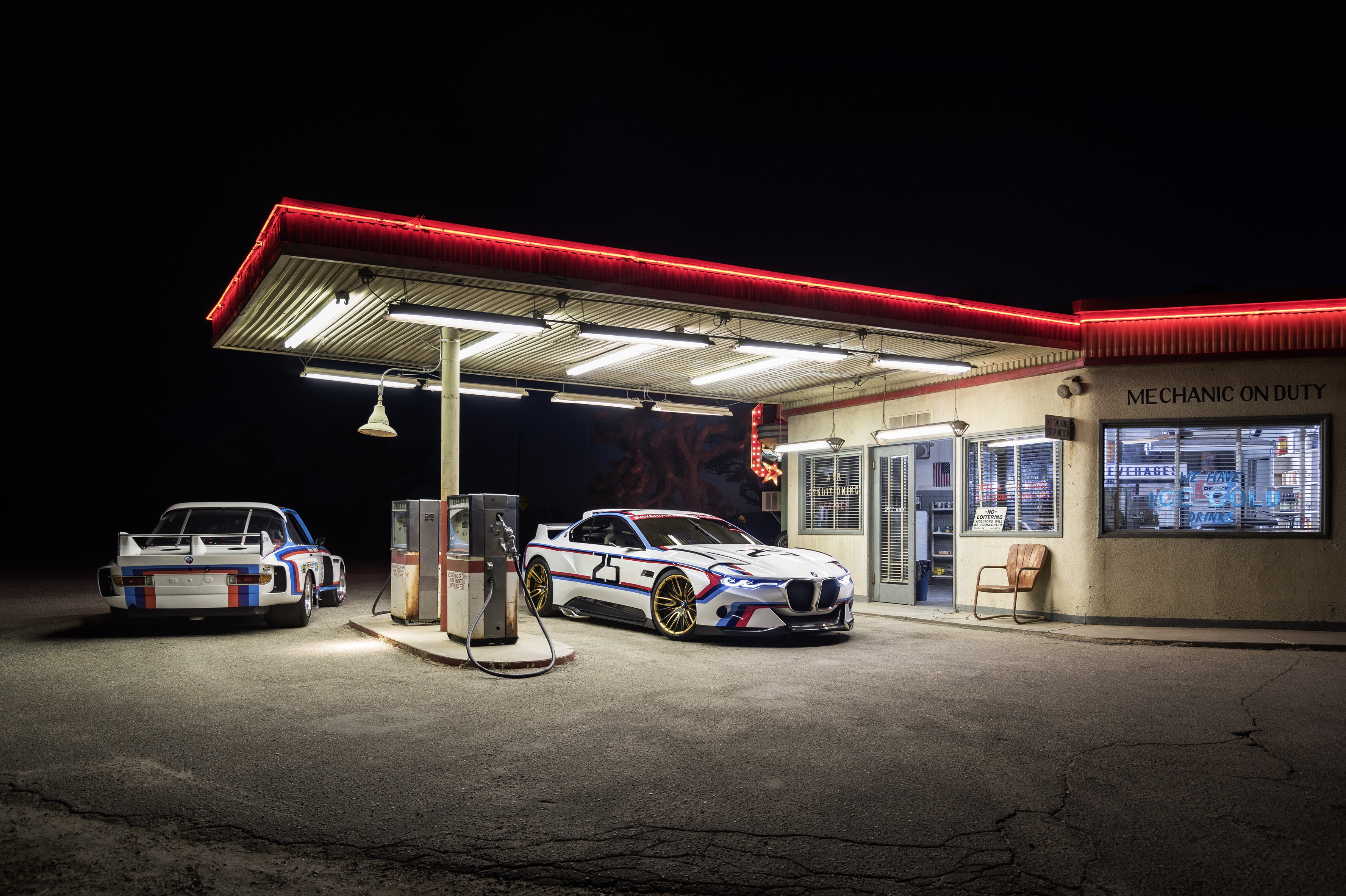 Two BMW M4 CSL cars at a retro gas station at night HD Wallpaper