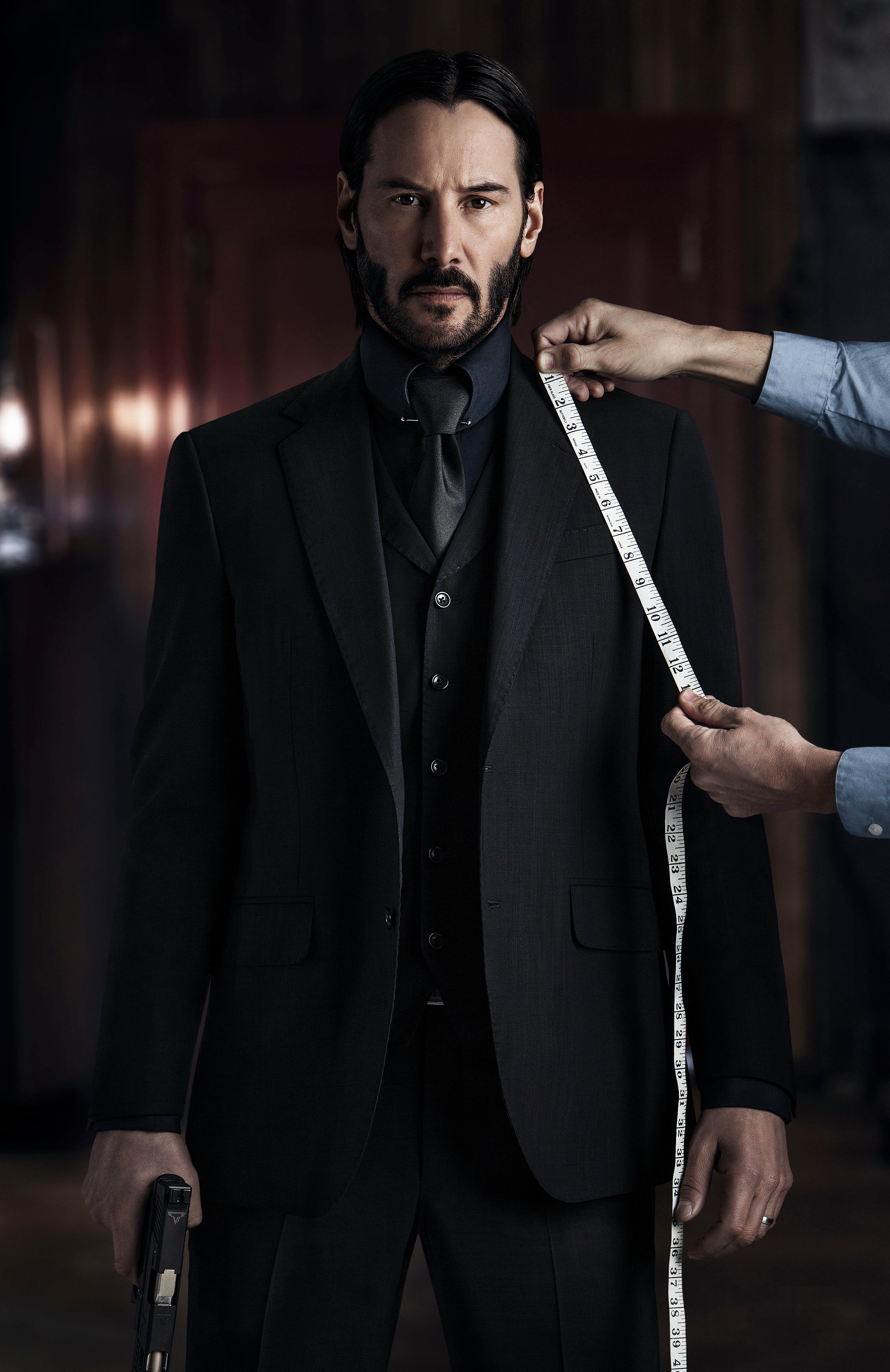 John Wick from John Wick: Chapter 2 being measured for a suit HD Phone Wallpaper