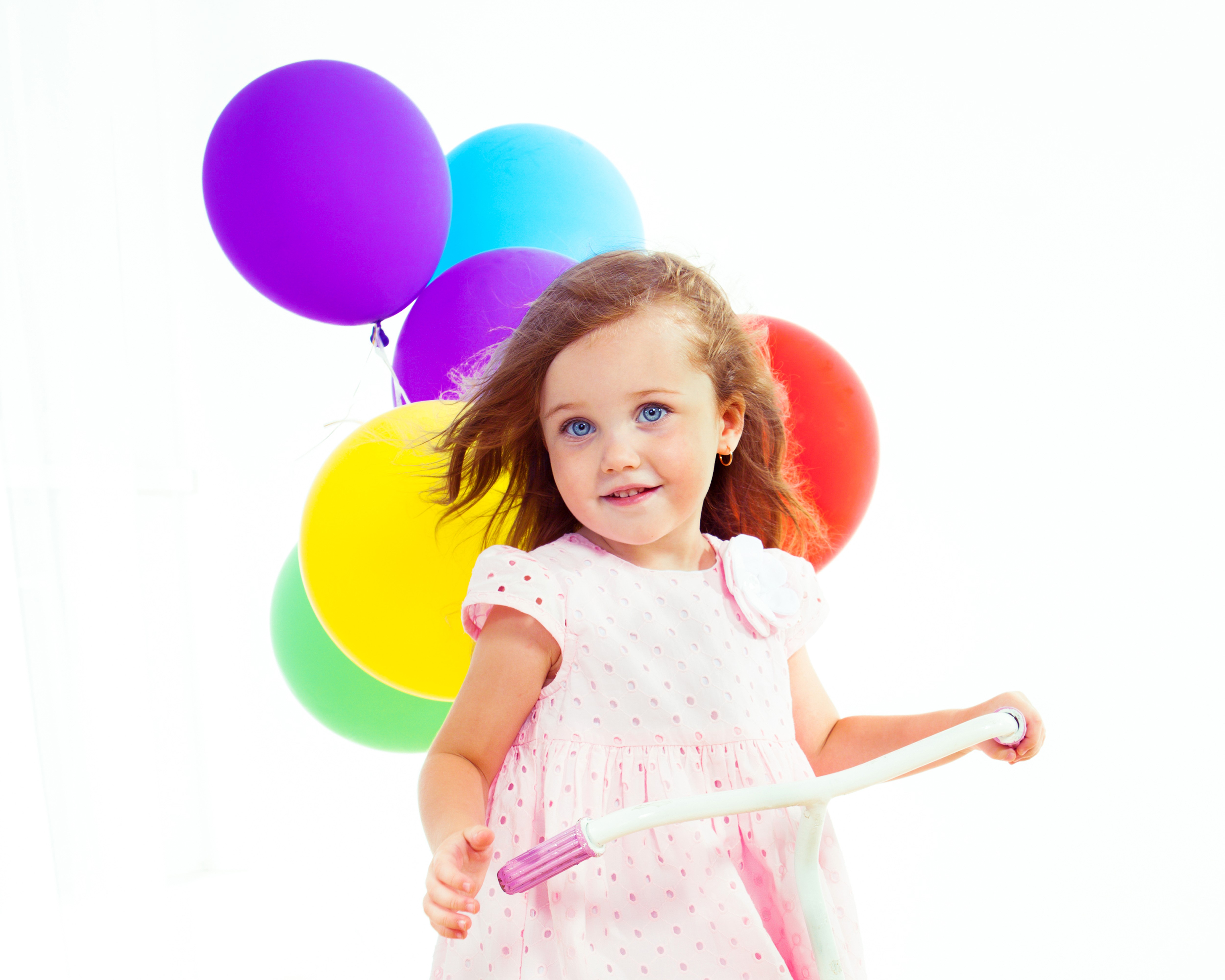 Little girl with balloons on a scooter HD Wallpaper