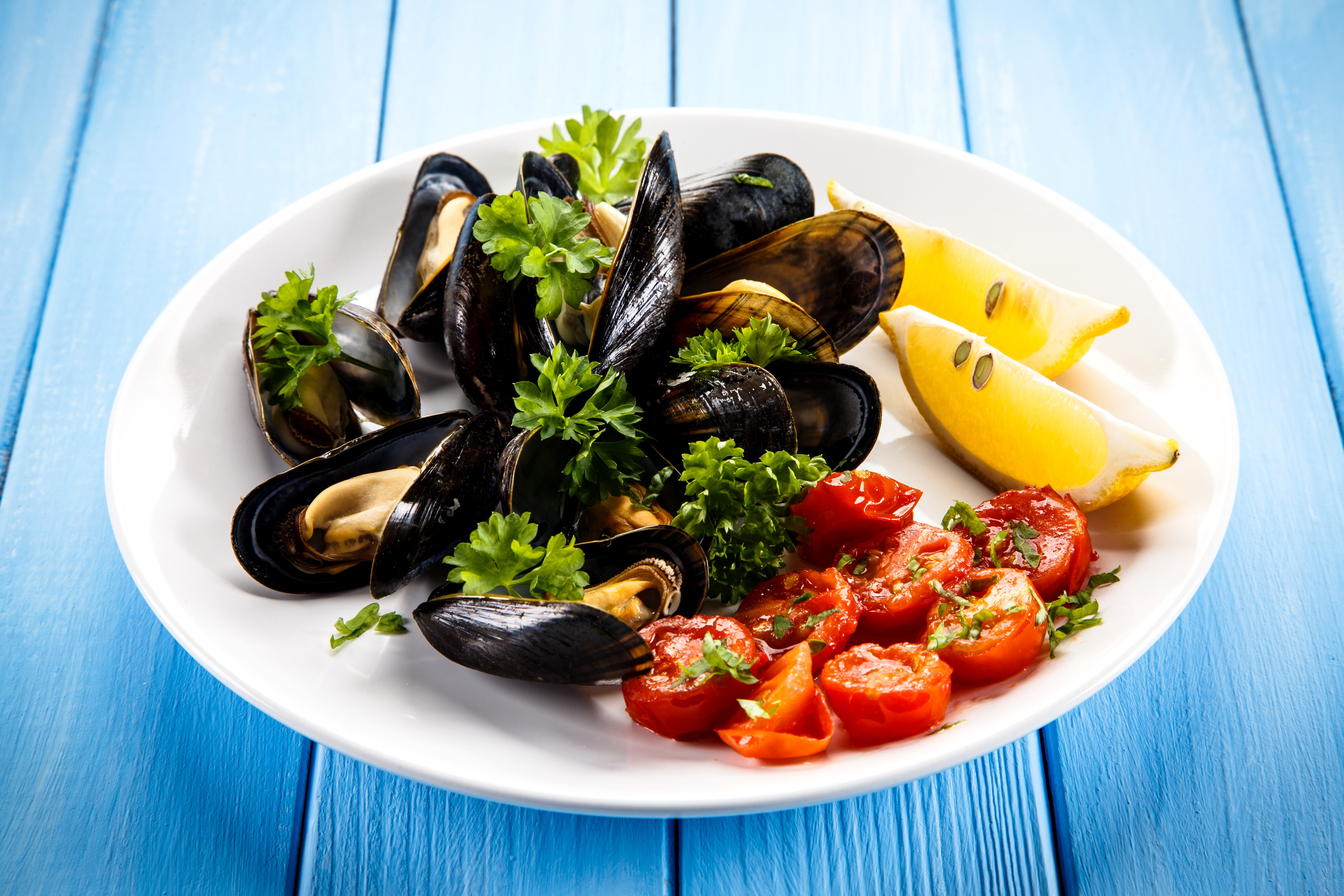 Seafoods with Tomatoes and Lemons on a Plate HD Wallpaper