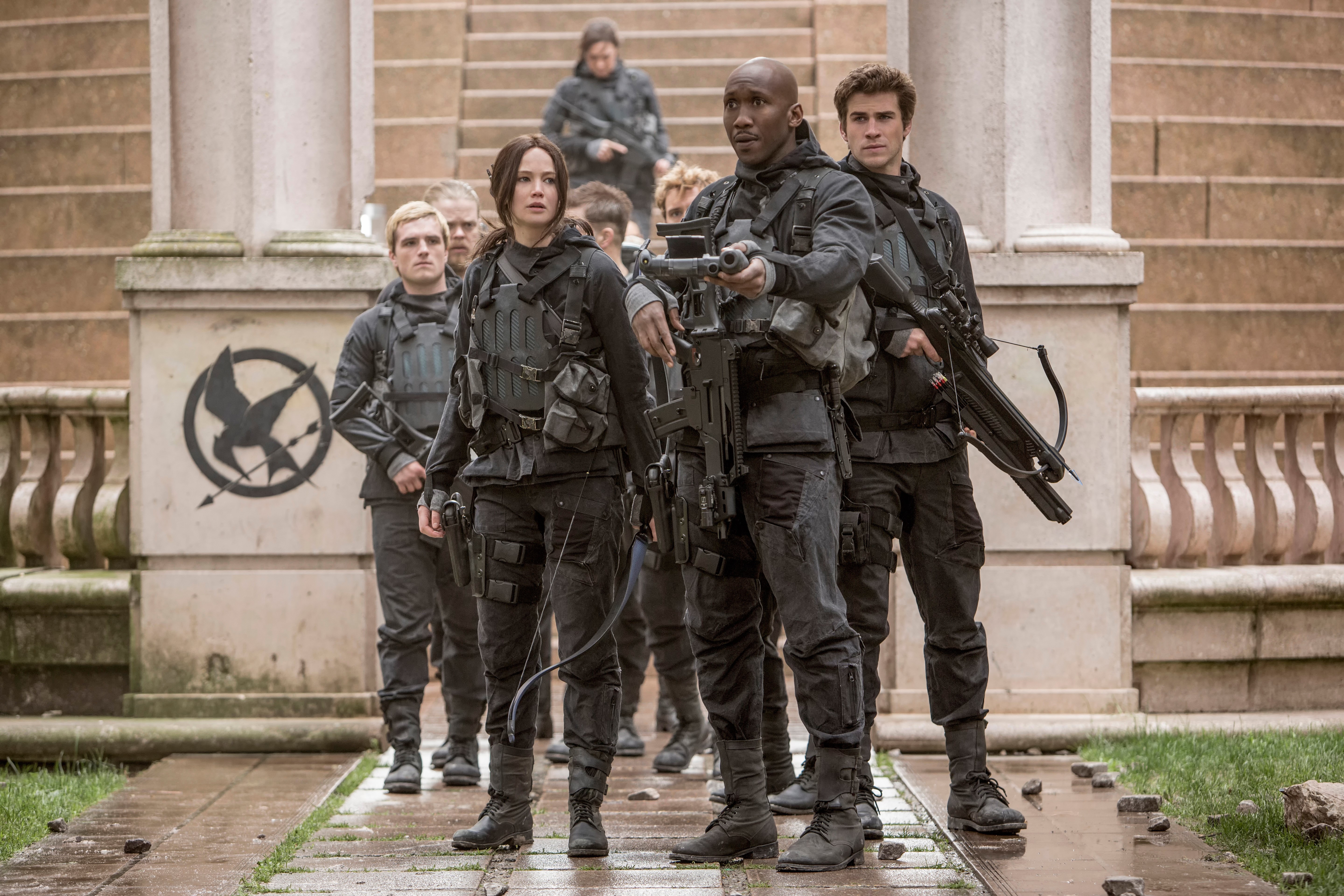 Jennifer Lawrence and warriors from The Hunger Games: Mockingjay Part 2 HD Wallpaper
