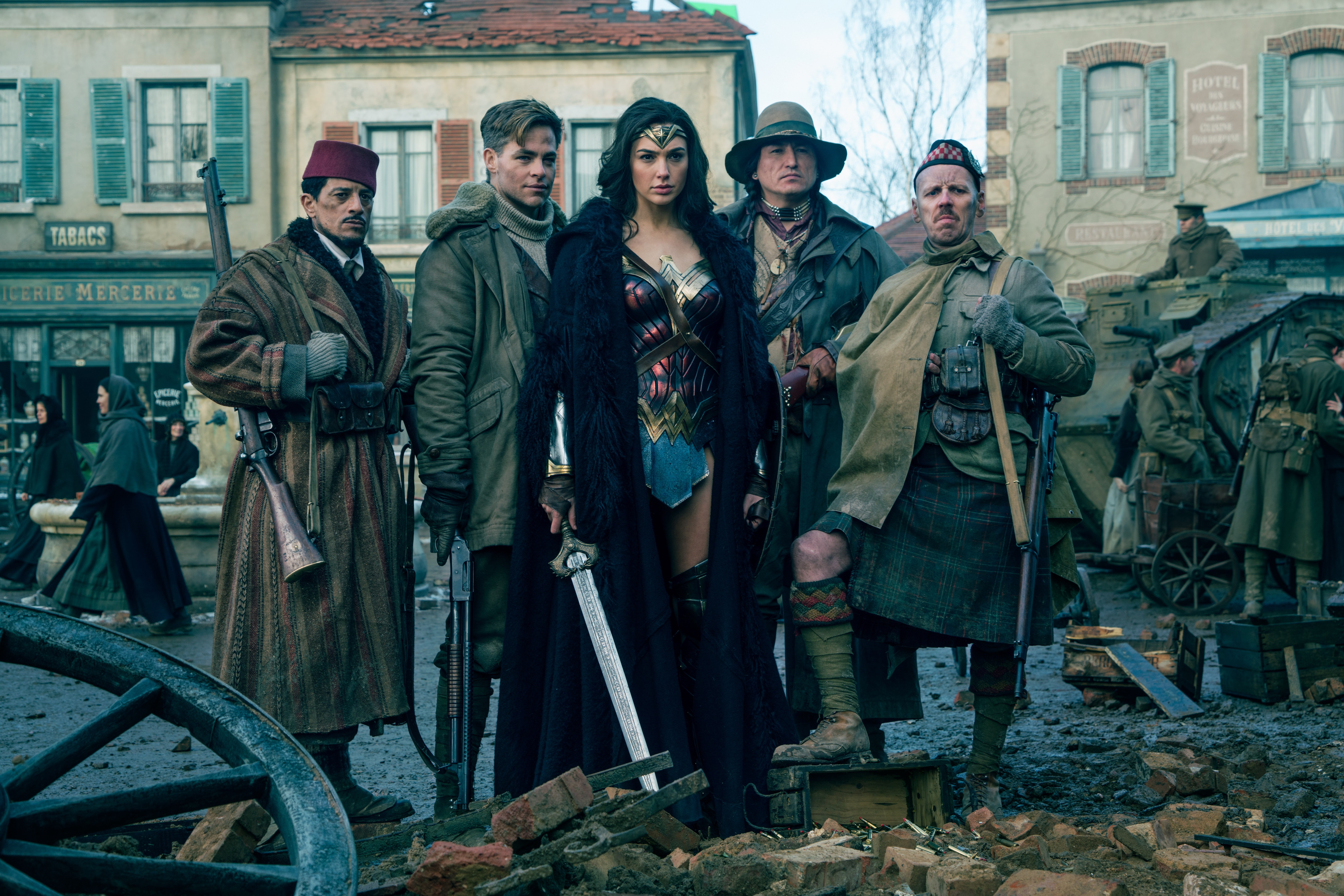 Wonder Woman and her companions in a town HD Wallpaper