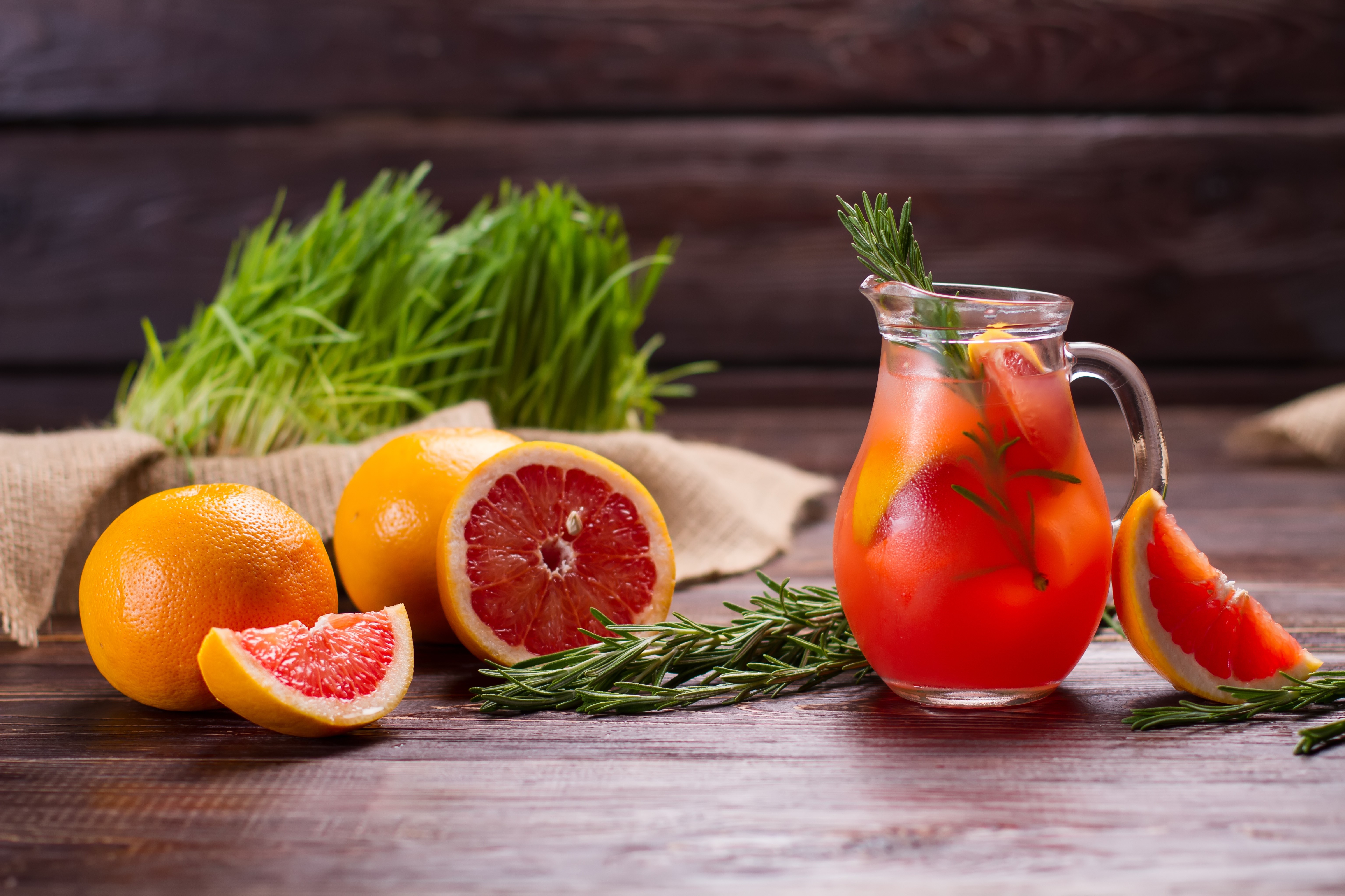 Grapefruit drink in a jug with grapefruits and rosemary HD Wallpaper