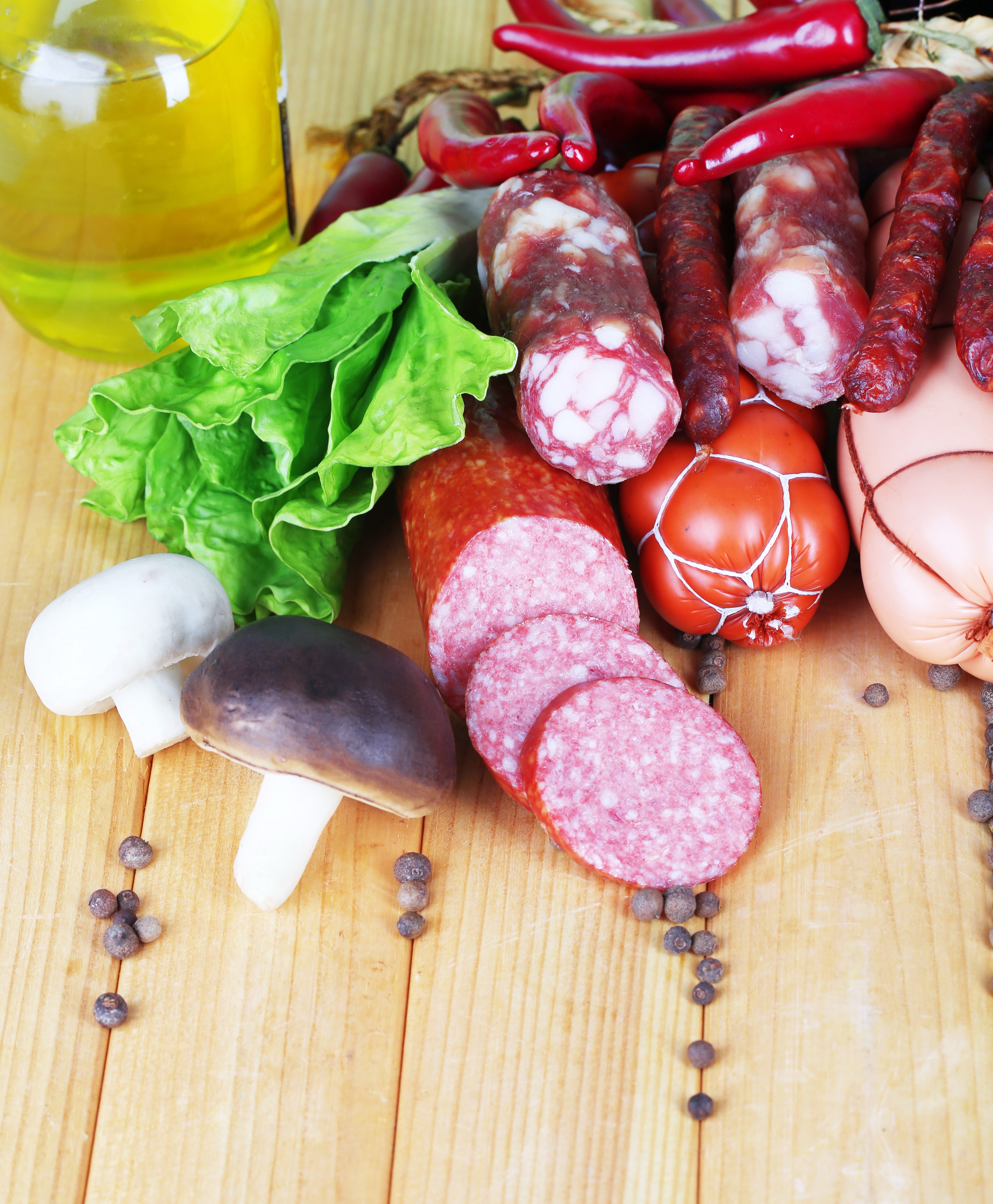 Sausages, mushrooms, and chili peppers on wood planks HD Phone Wallpaper