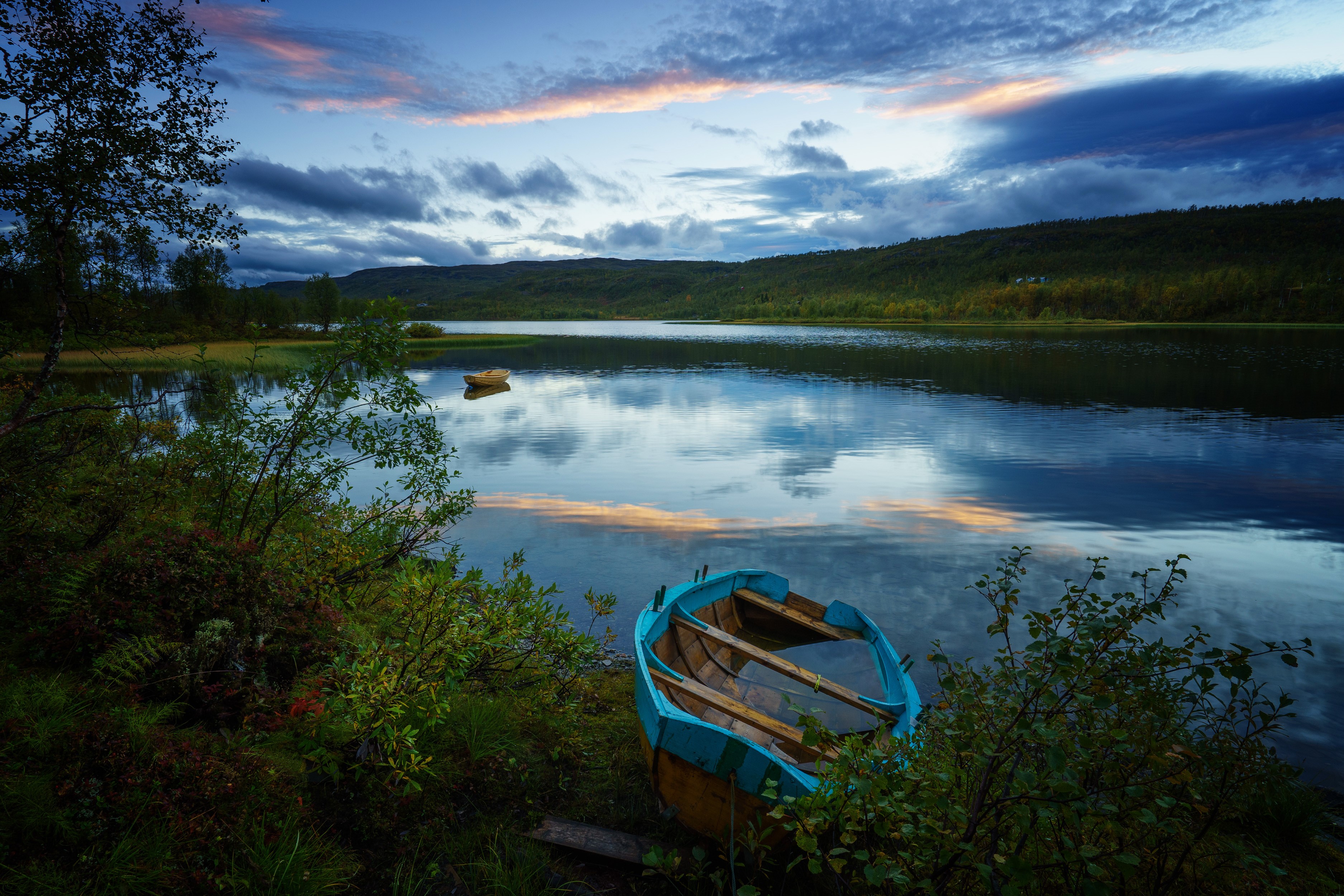 Boat on a lake at dusk in Norway HD Wallpaper