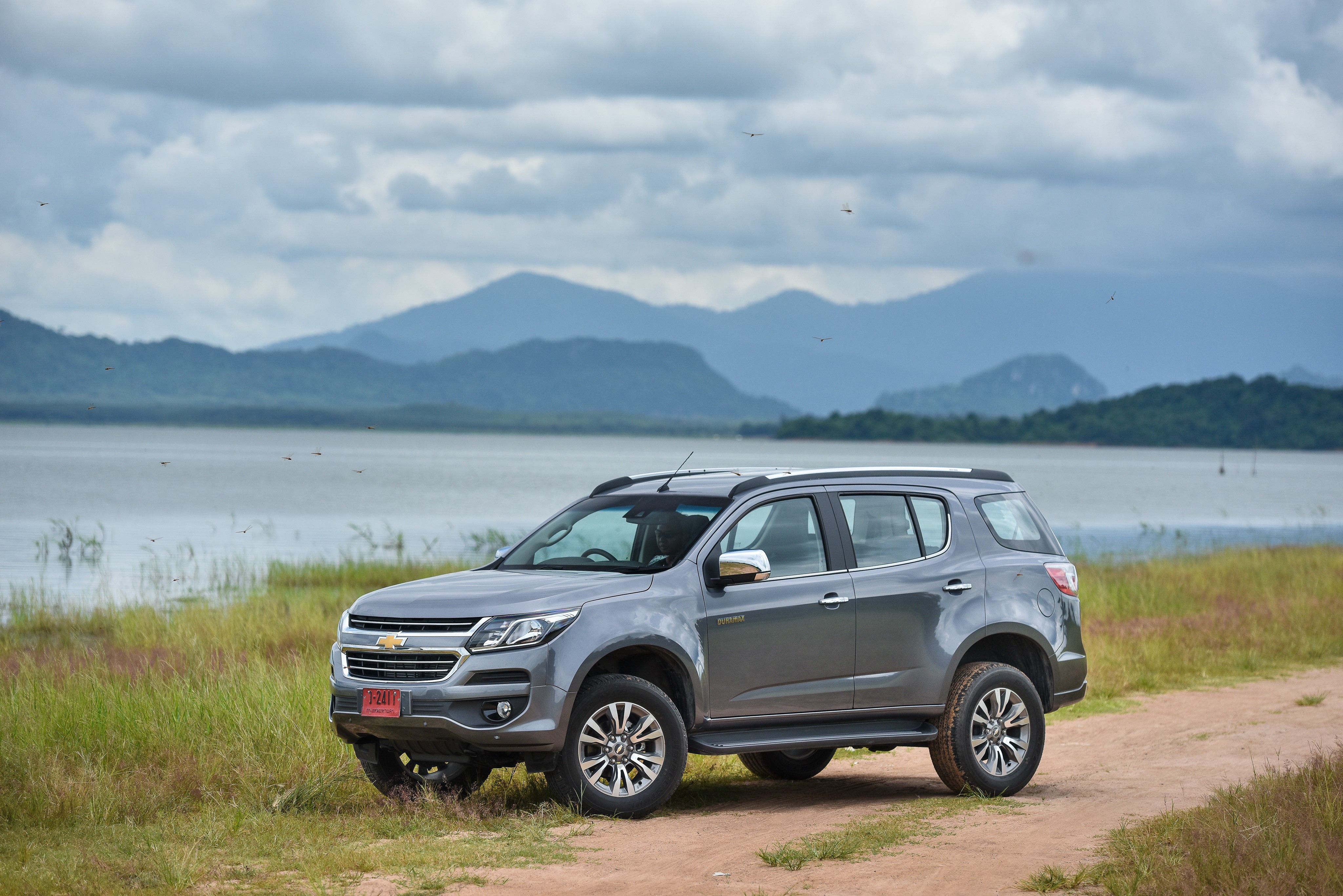Grey Chevrolet Trailblazer SUV by a lake HD Wallpaper