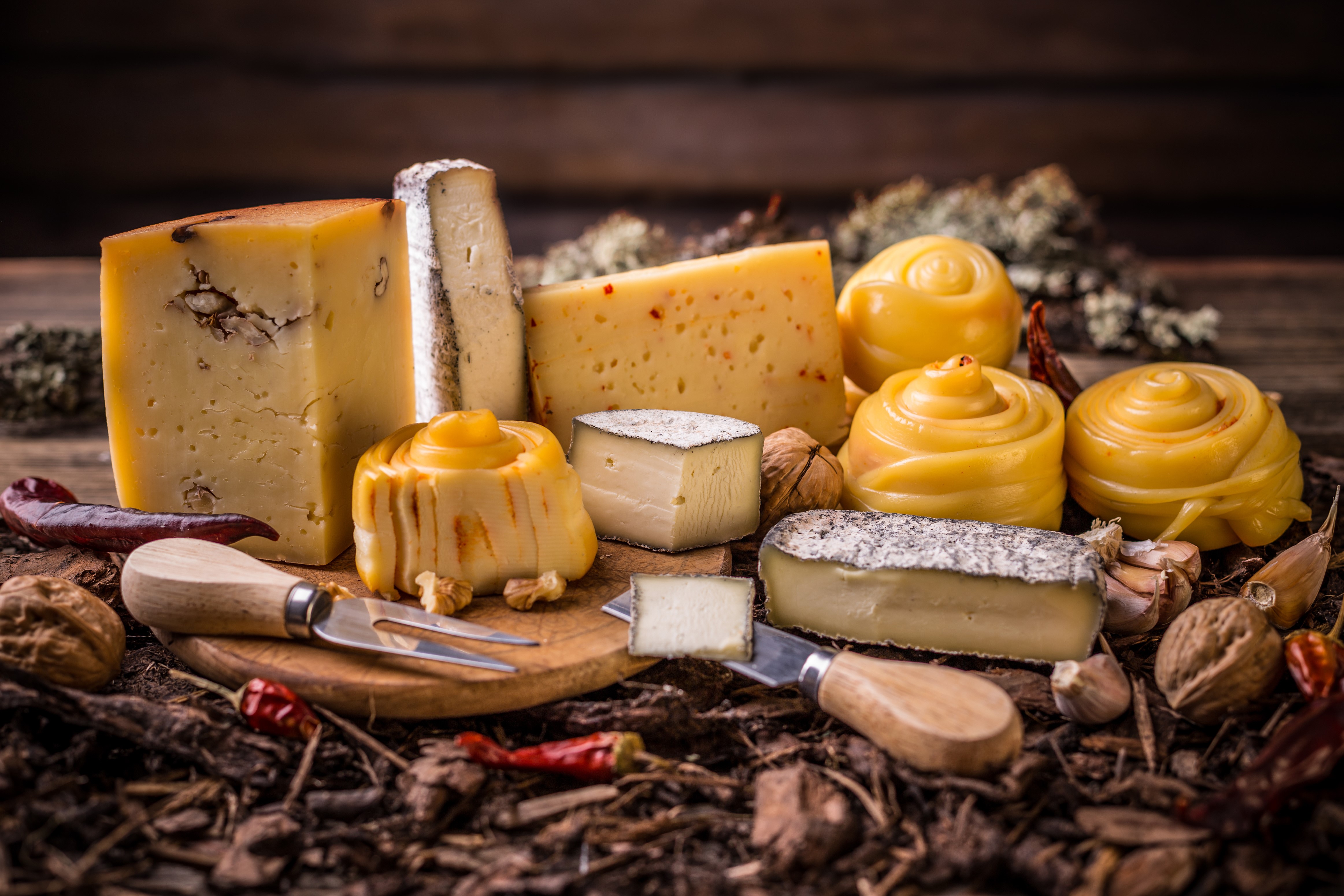 Assortment of Cheeses with Nuts and Peppers HD Wallpaper