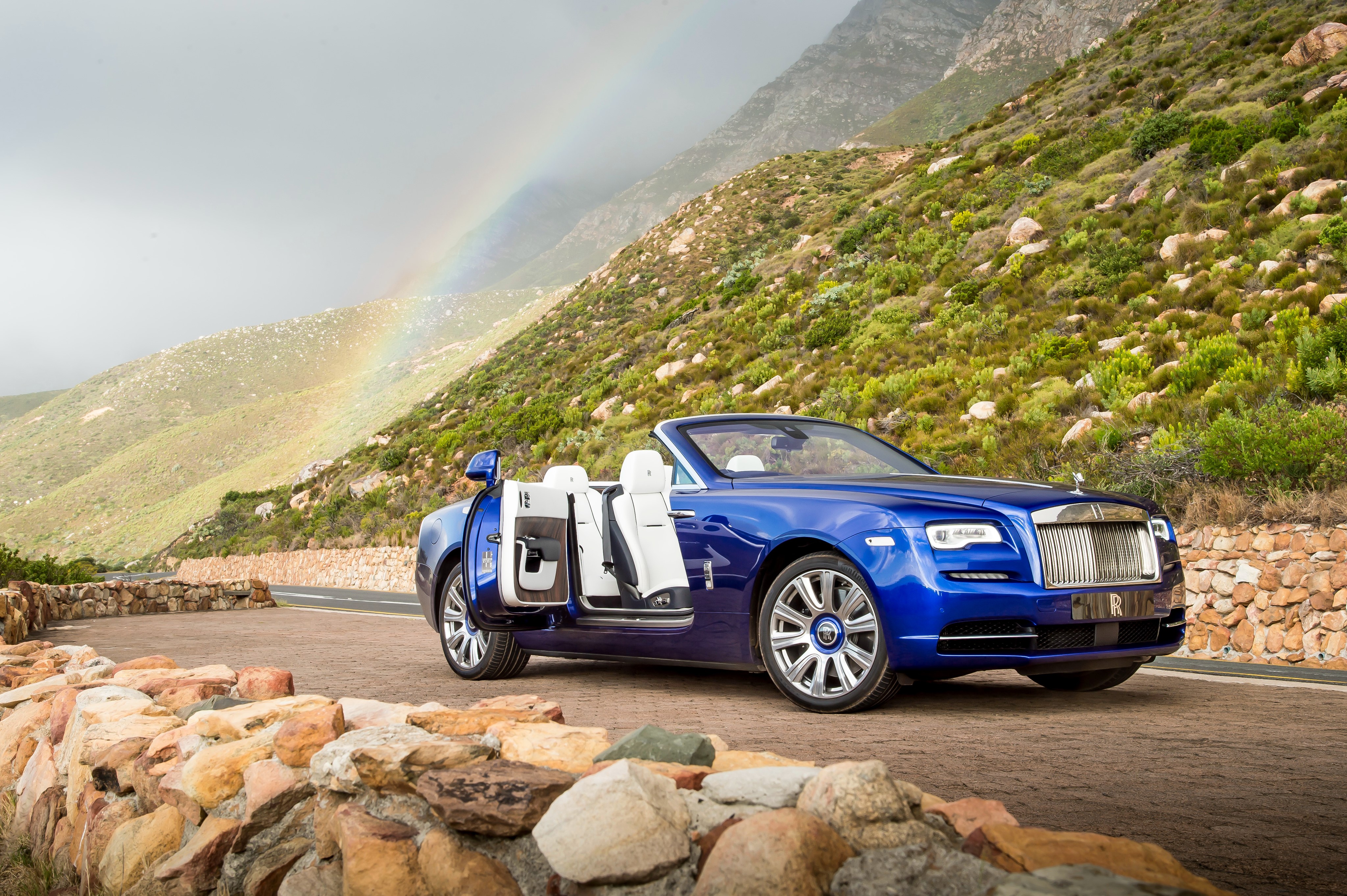 Blue Rolls-Royce Cabriolet on a Coastal Road with Rainbow HD Wallpaper
