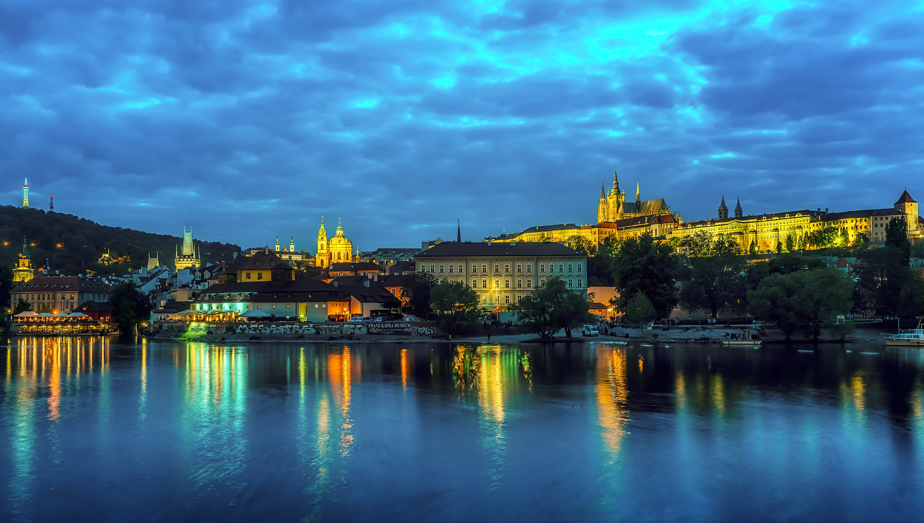 Prague cityscape with river and castle at dusk HD Wallpaper