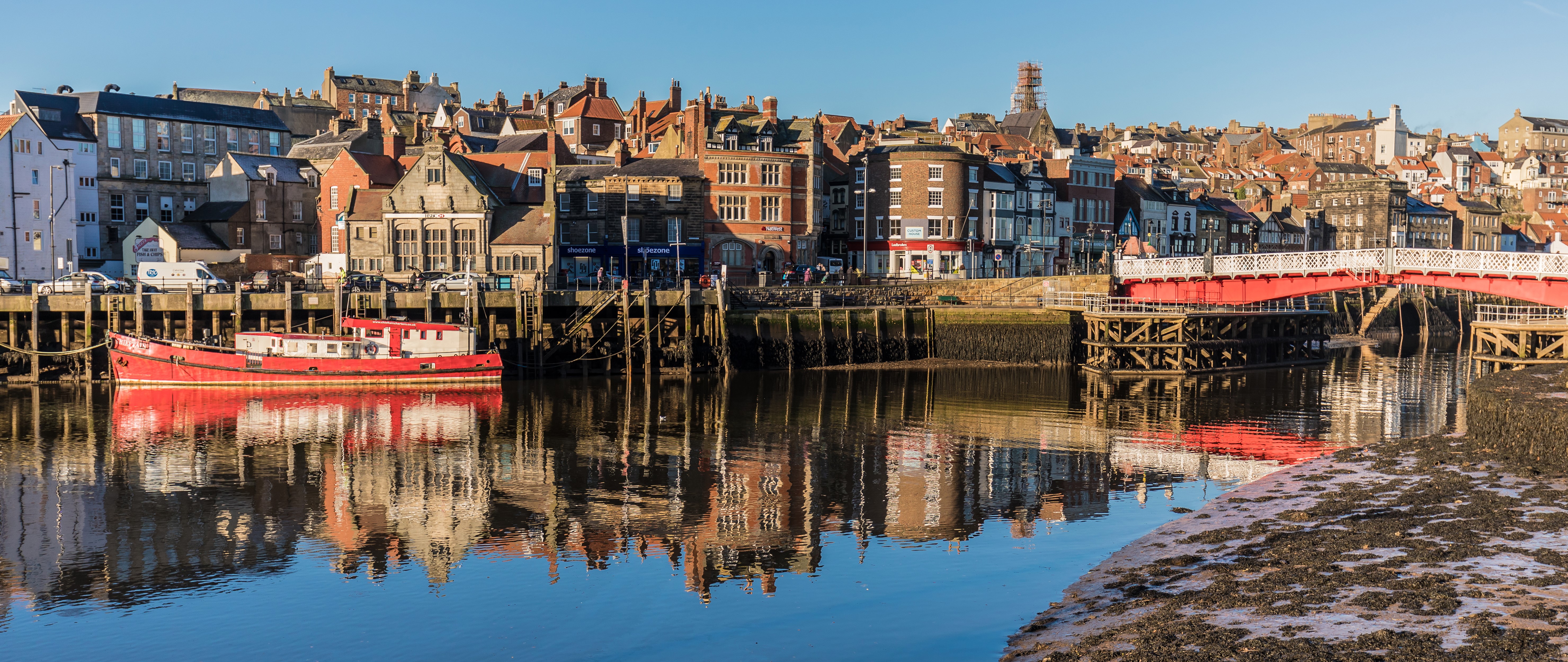 Whitby England Riverfront with Red Boat and Bridge HD Wallpaper