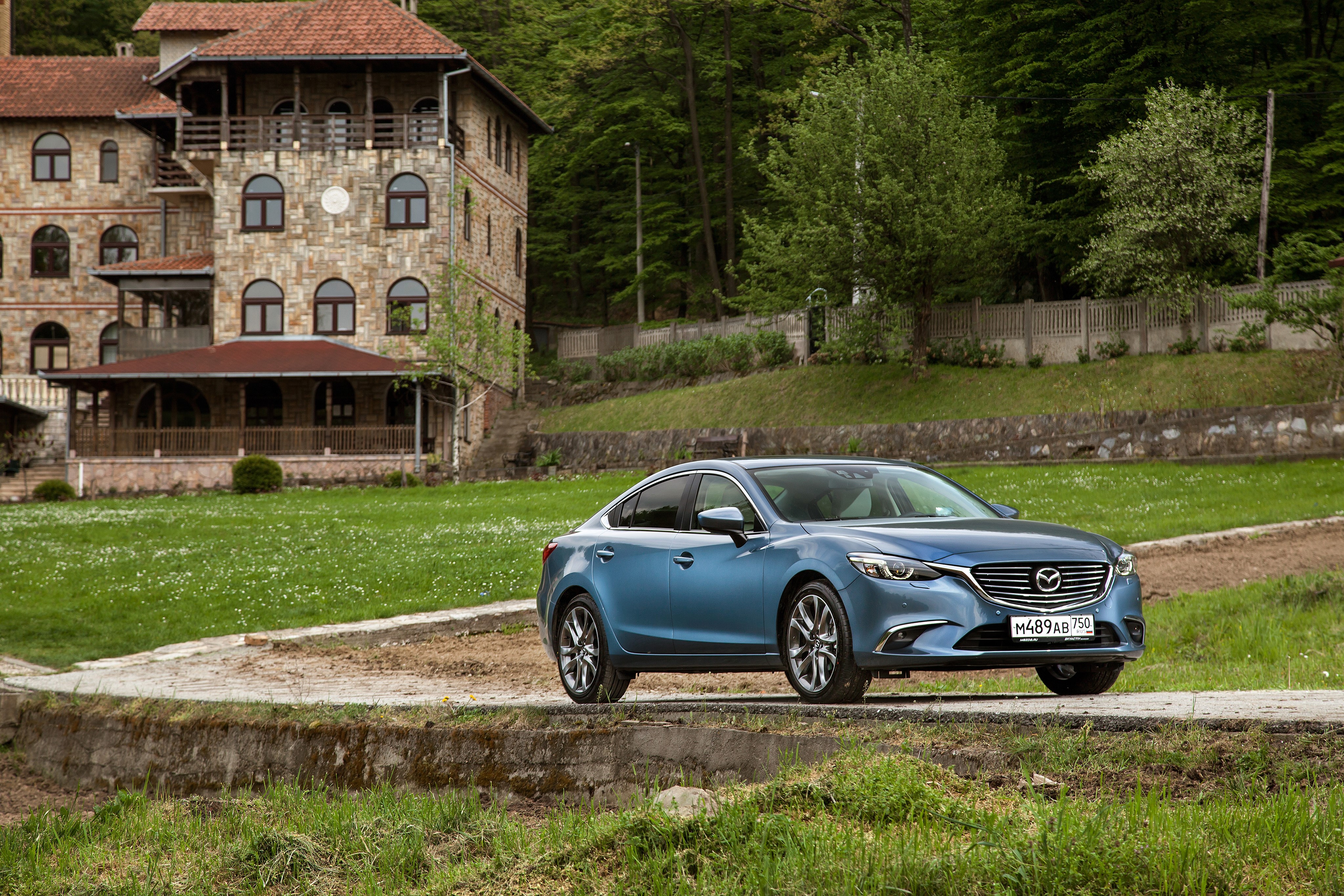 Blue 2015 Mazda 6 Sedan parked near a stone building HD Wallpaper