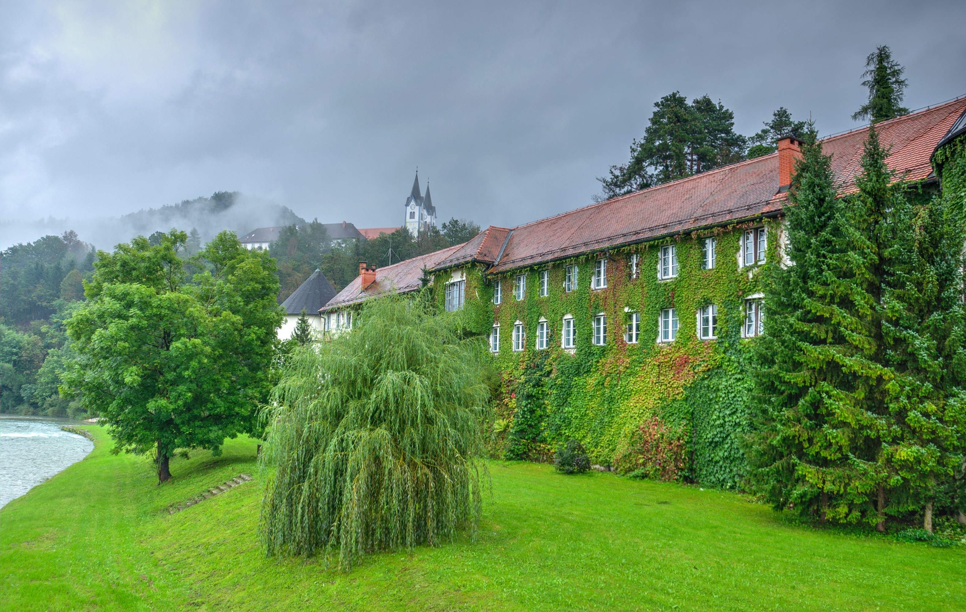 Vrbovec Castle in Nazarje, Slovenia, covered in ivy HD Wallpaper