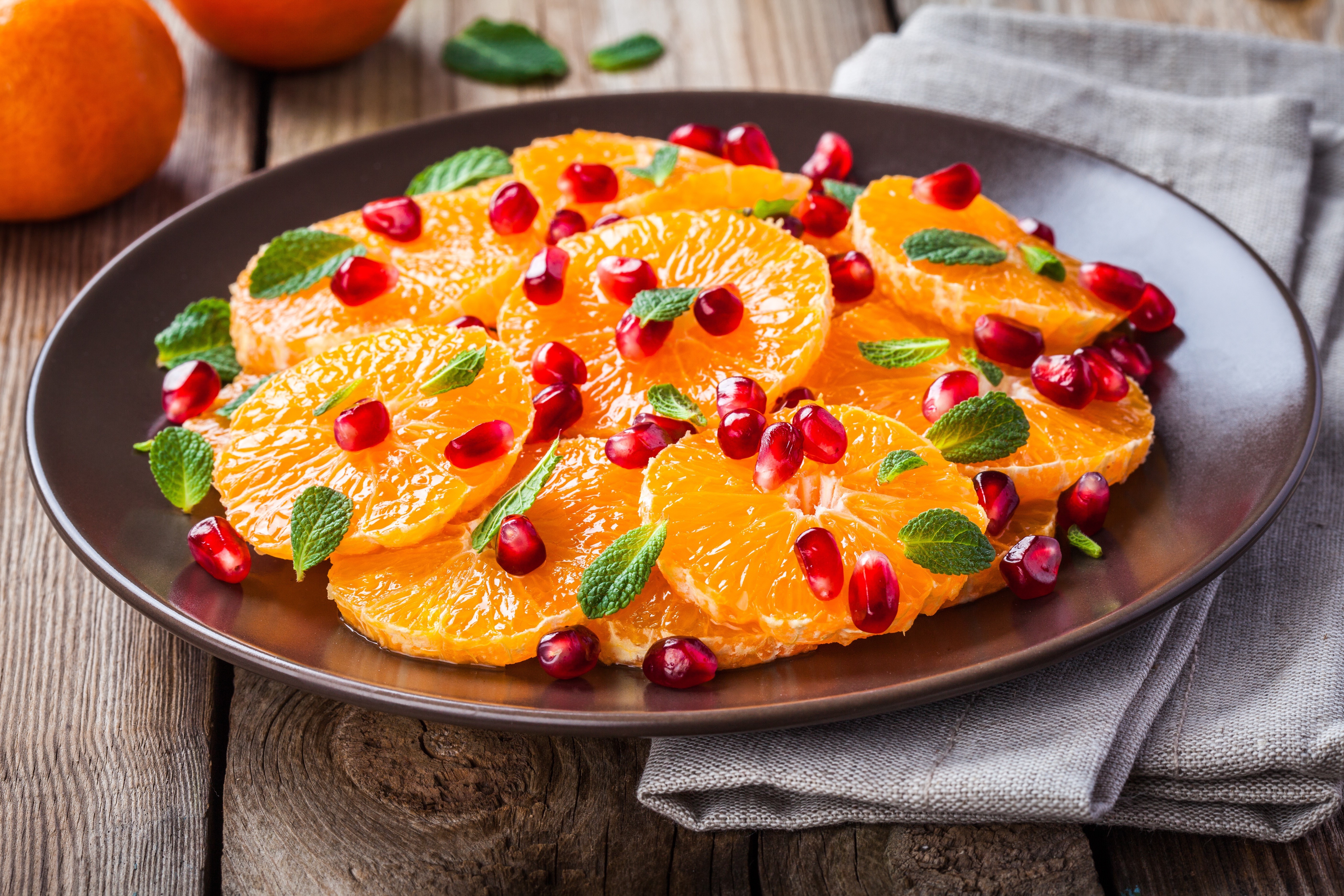 Orange slices with pomegranate seeds and mint HD Wallpaper