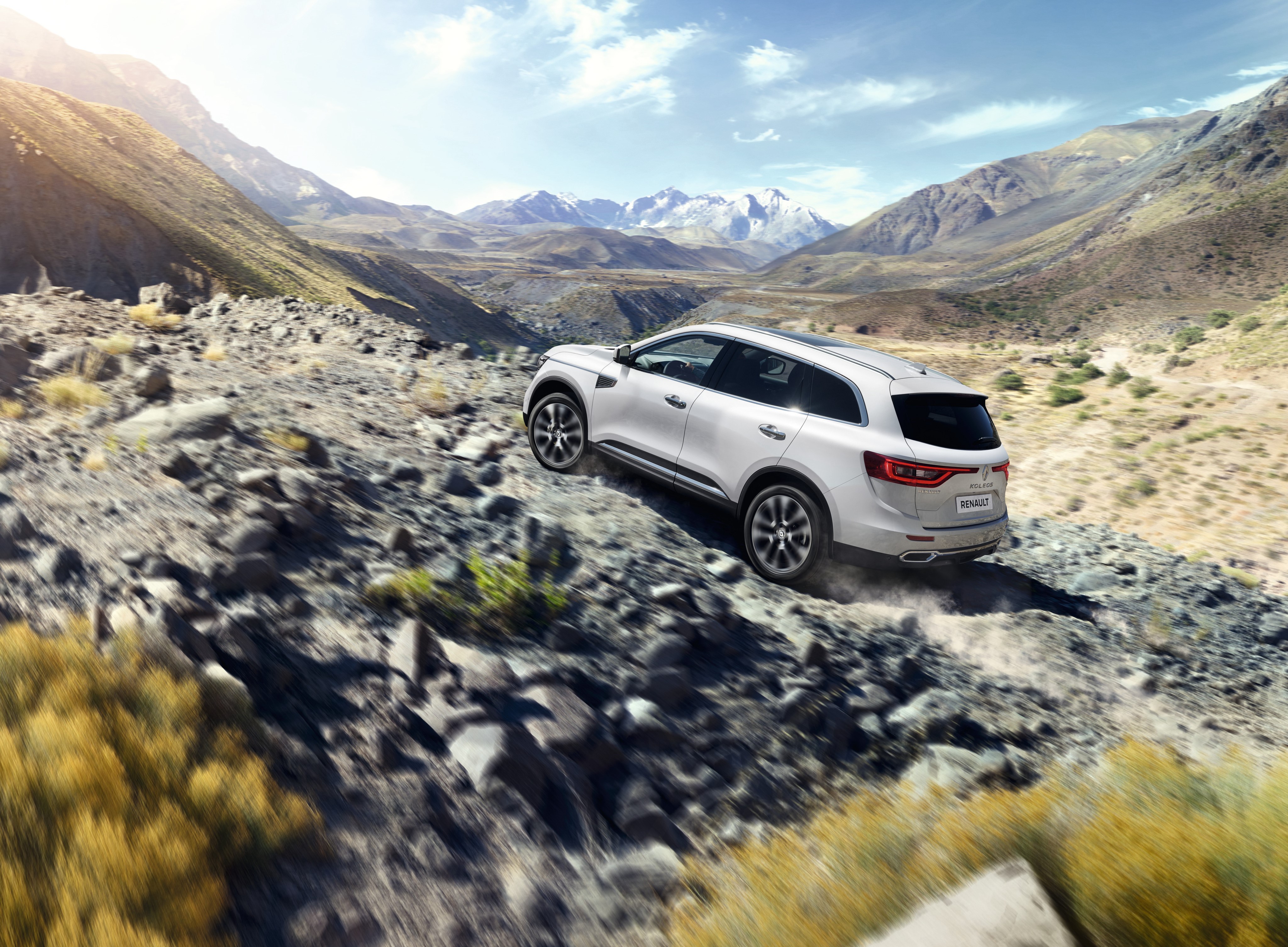 White Renault Koleos driving on a rocky mountain road HD Wallpaper