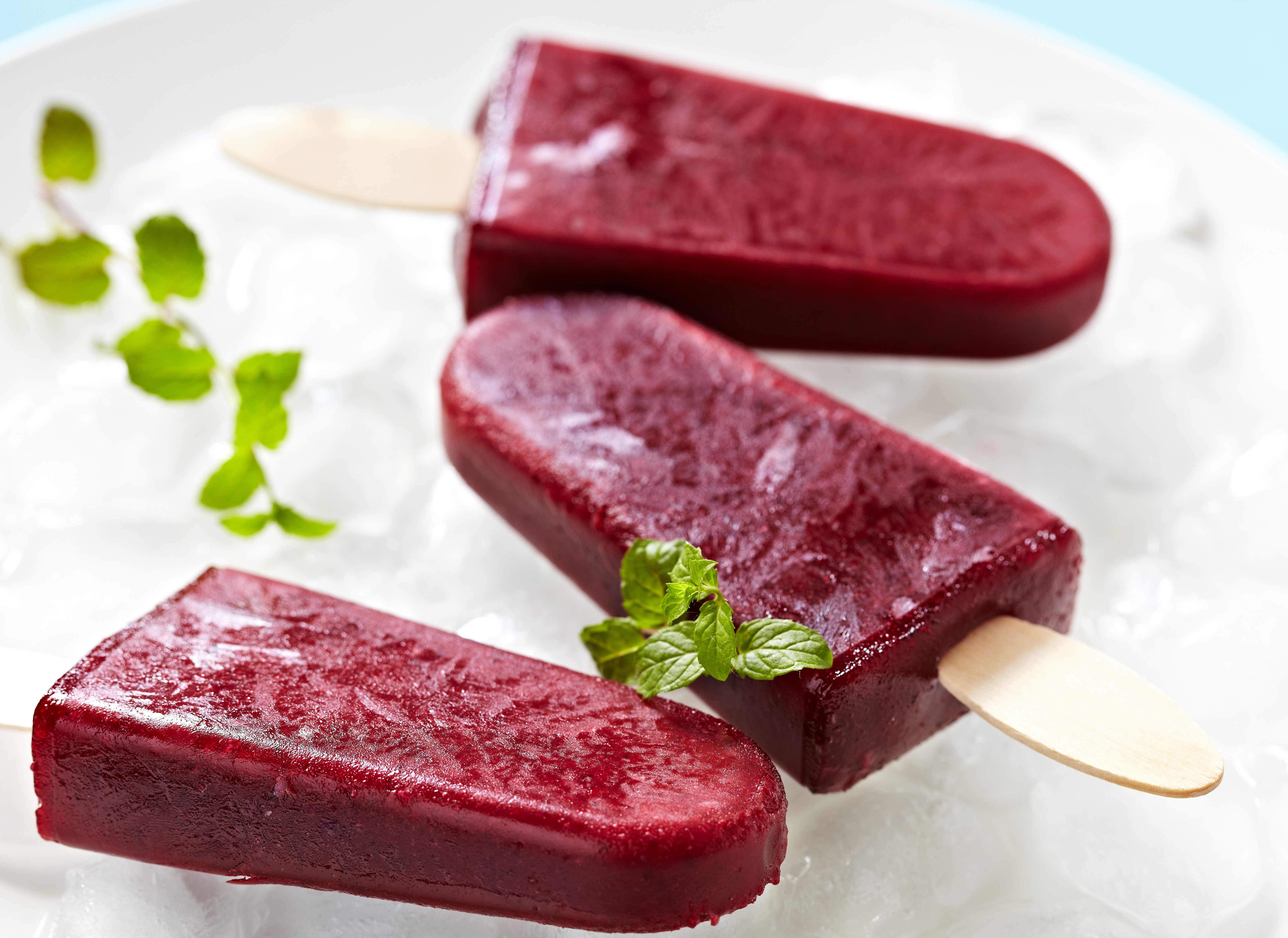 Three berry popsicles on ice HD Wallpaper