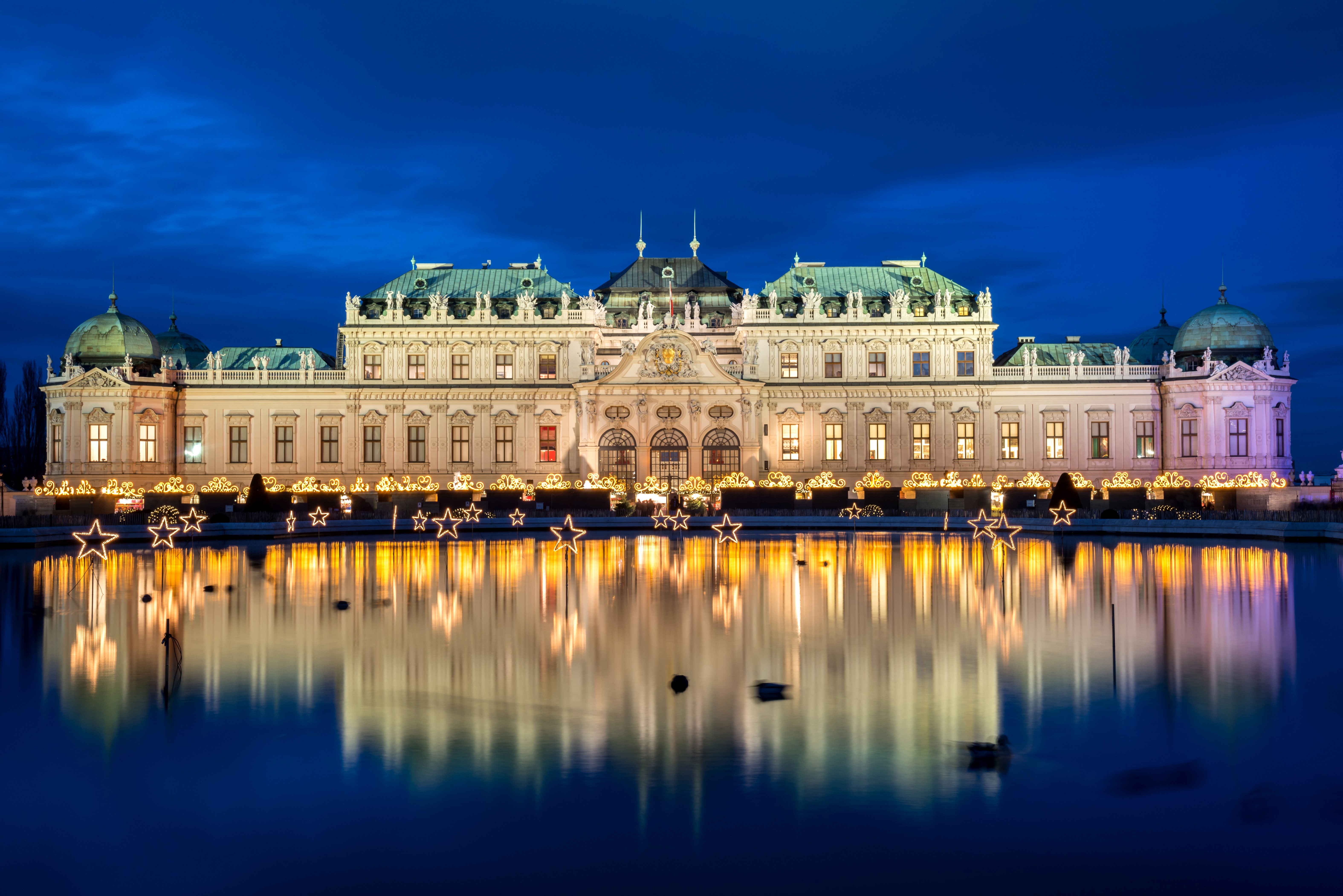 Palace Belvedere at night with star decorations and reflection HD Wallpaper