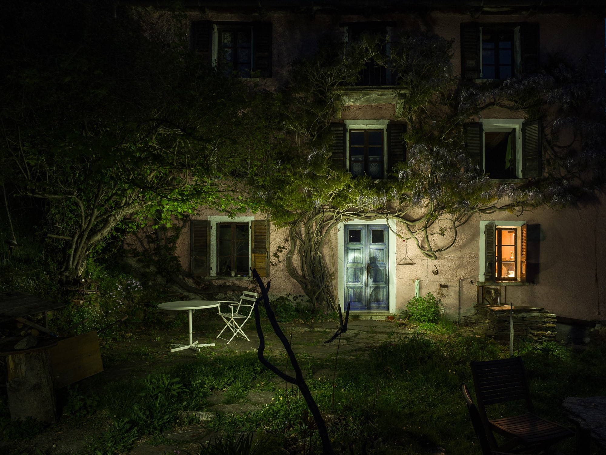 House at night with wisteria in Gurro, Piedmont, Italy HD Wallpaper