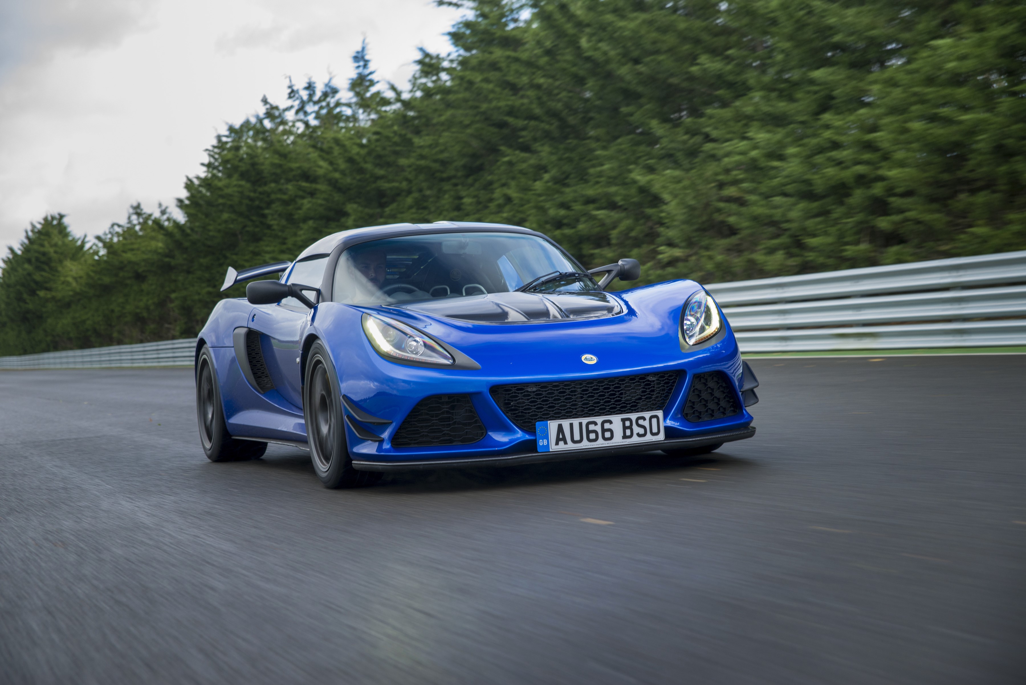 Blue Lotus Exige Sport 380 driving on a track HD Wallpaper