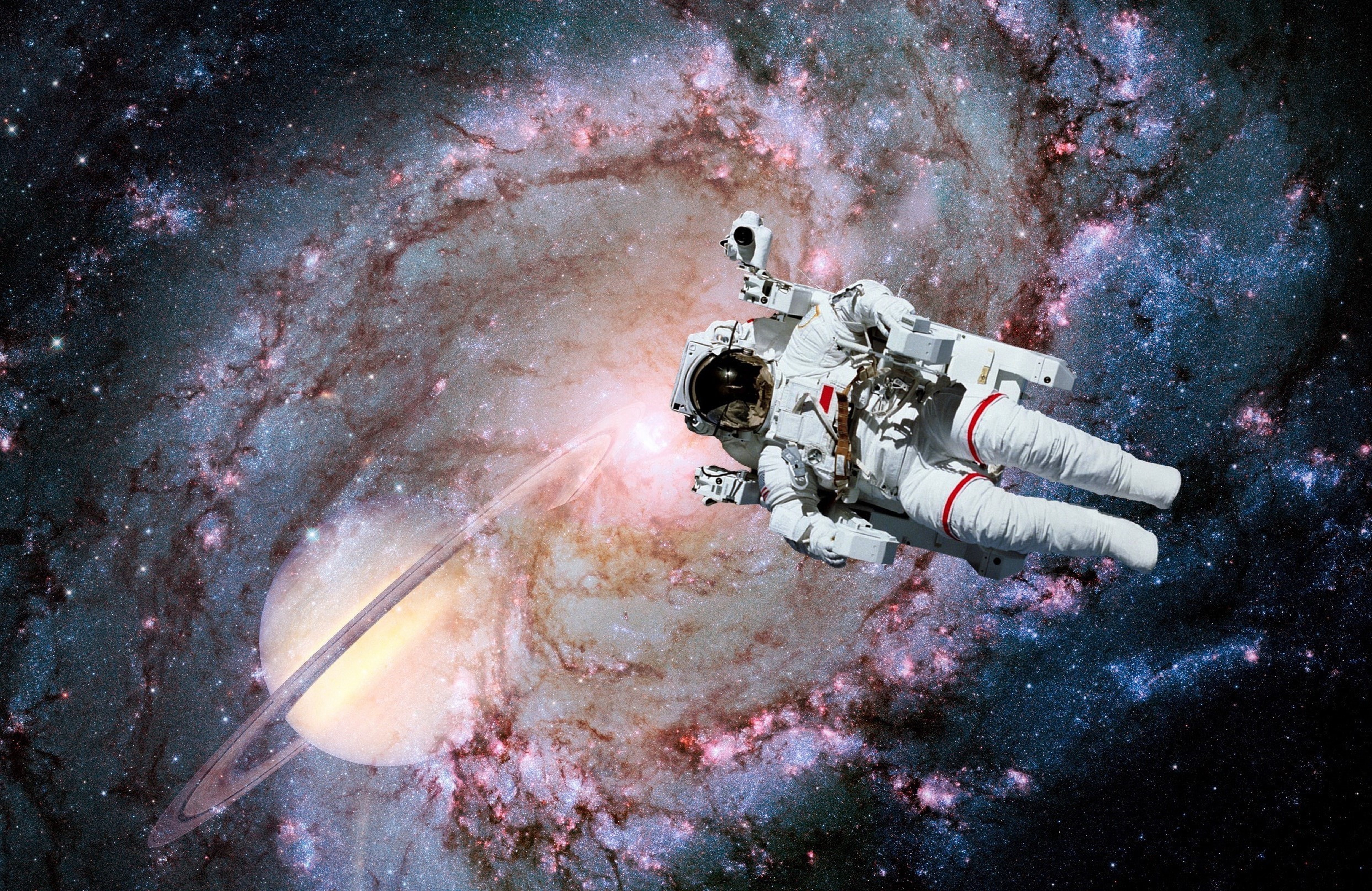 Astronaut floating near Saturn and galaxy HD Wallpaper